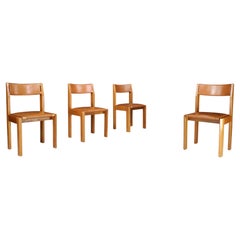 Juego de cuatro sillas de comedor Luigi Gorgoni de olmo y cuero para Roche Bobois.