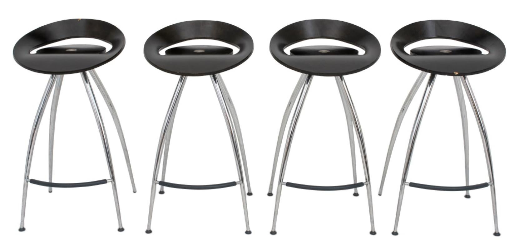 This is a set of four Lyra Bar stools designed by Sigurdur Thorsteinsson through Design Group Italia for Magis. The stools are comprised of a chromed steel tube frame and a laminated dark wood seat. The 4 supportive legs help distribute the weight