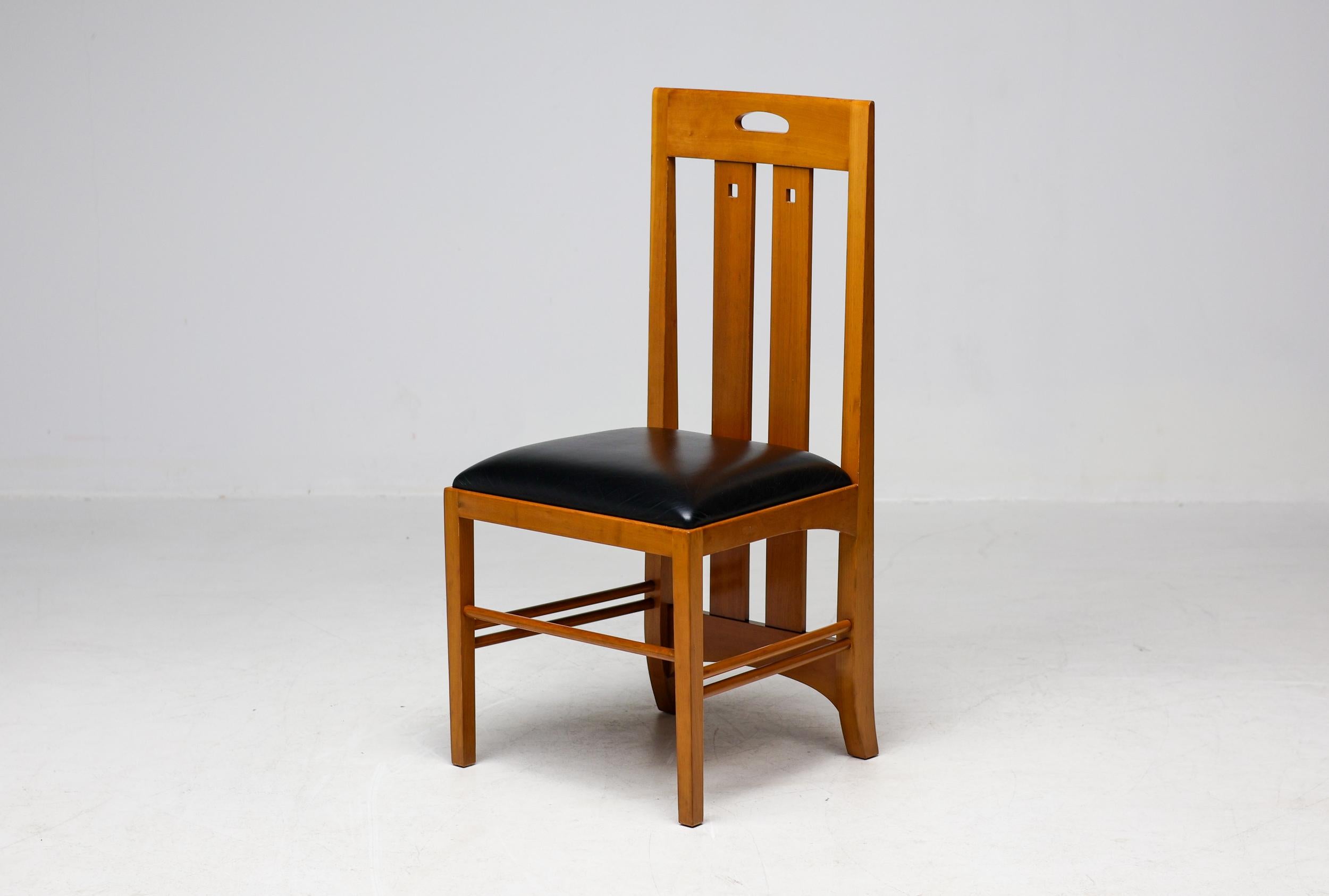 Exquisite set of 4 Charles Rennie Mackintosh “309 Ingram” dining chairs for Cassina in stained cherry and black leather.  
The 309 Ingram dining chairs, designed by Charles Rennie Mackintosh in the early 20th century, exemplify his distinctive