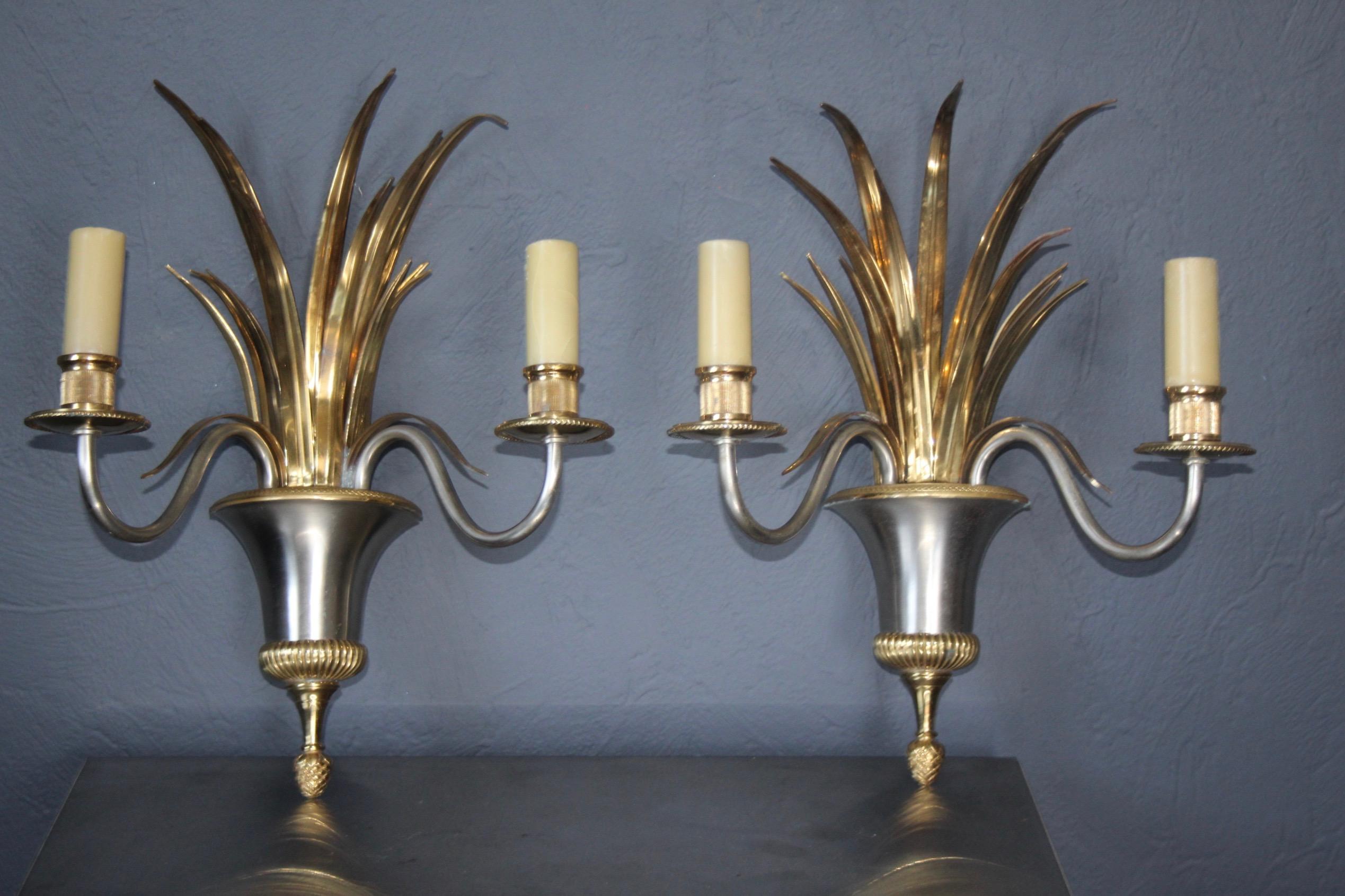 Pair of bicolor Maison Charles wall light.