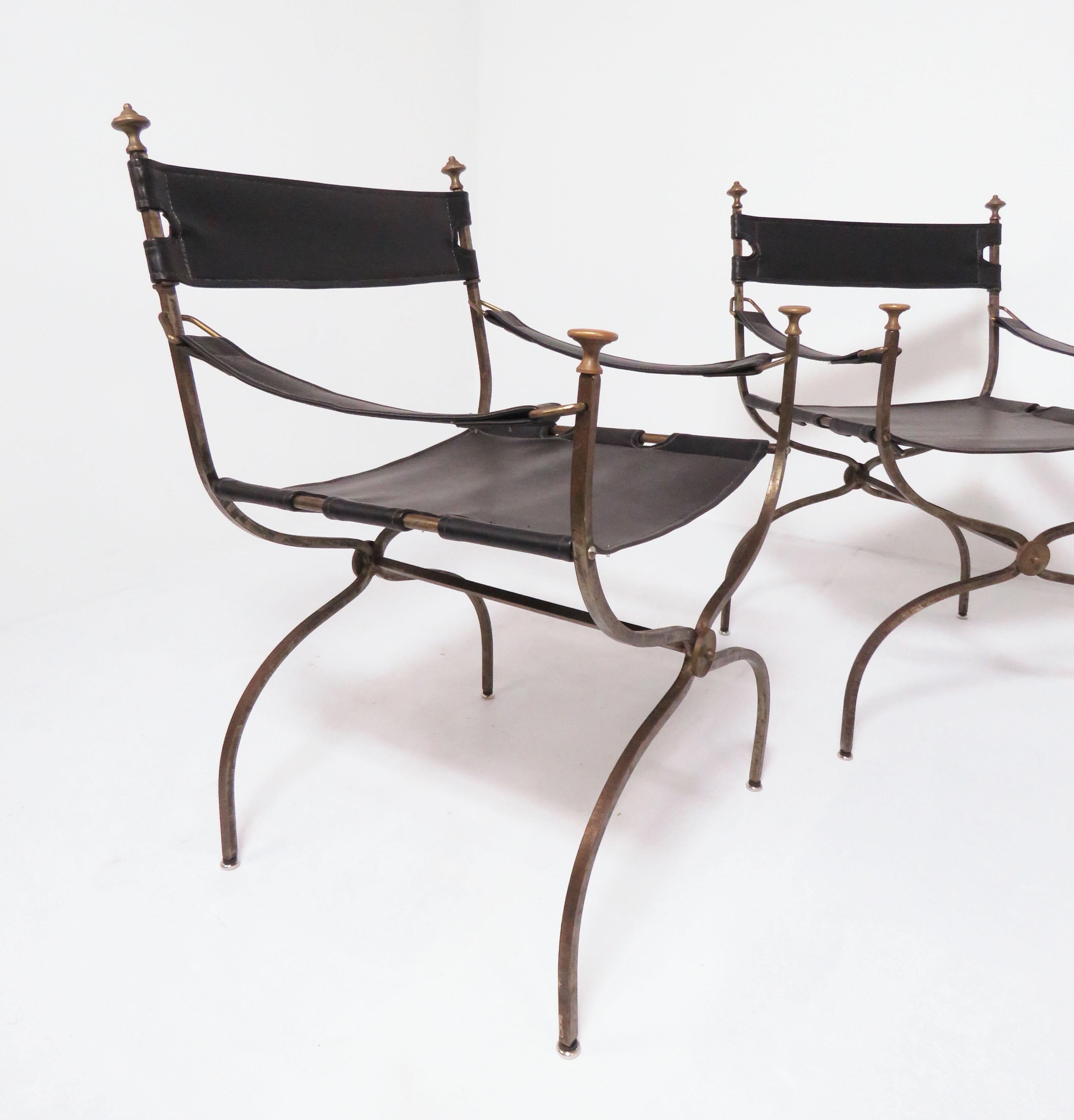 Set of four Campaign chairs in steel and brass in the manner of Maison Jansen, circa 1960s. Unmarked, most likely Italian.