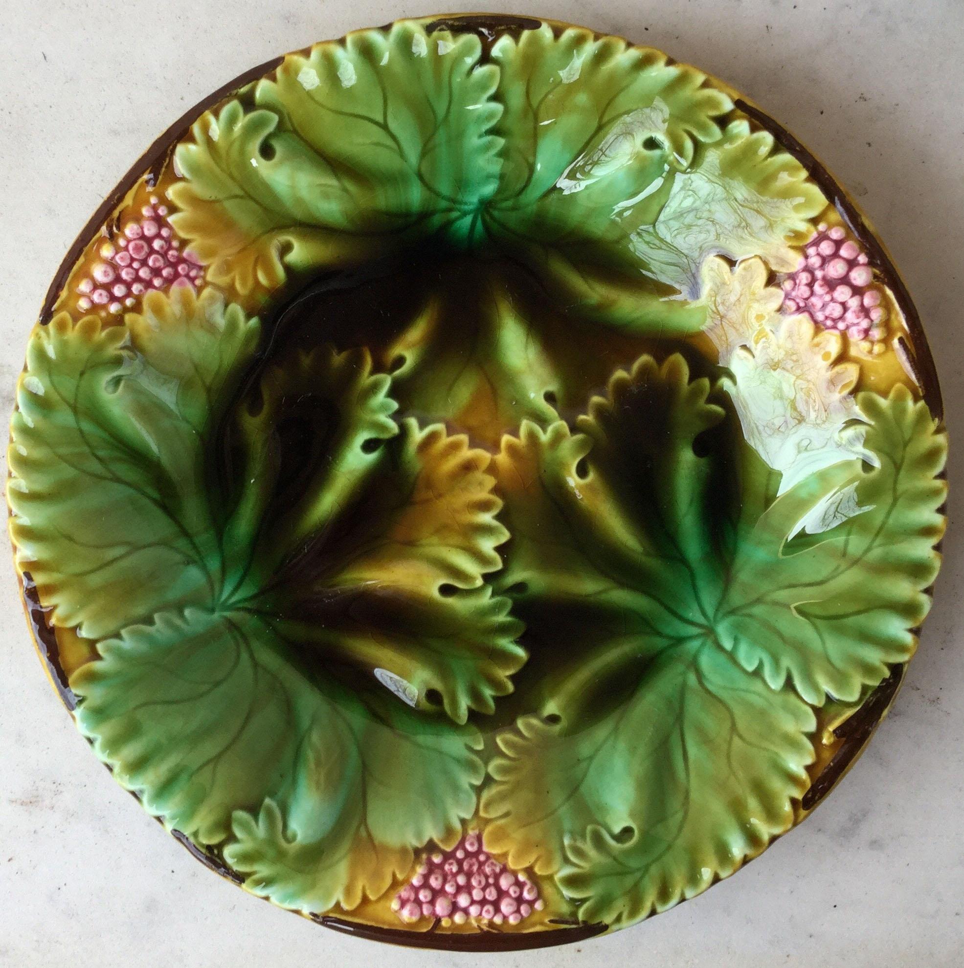 Beautiful set of 4 Majolica plates with leaves and berries signed Sarreguemines, circa 1890.