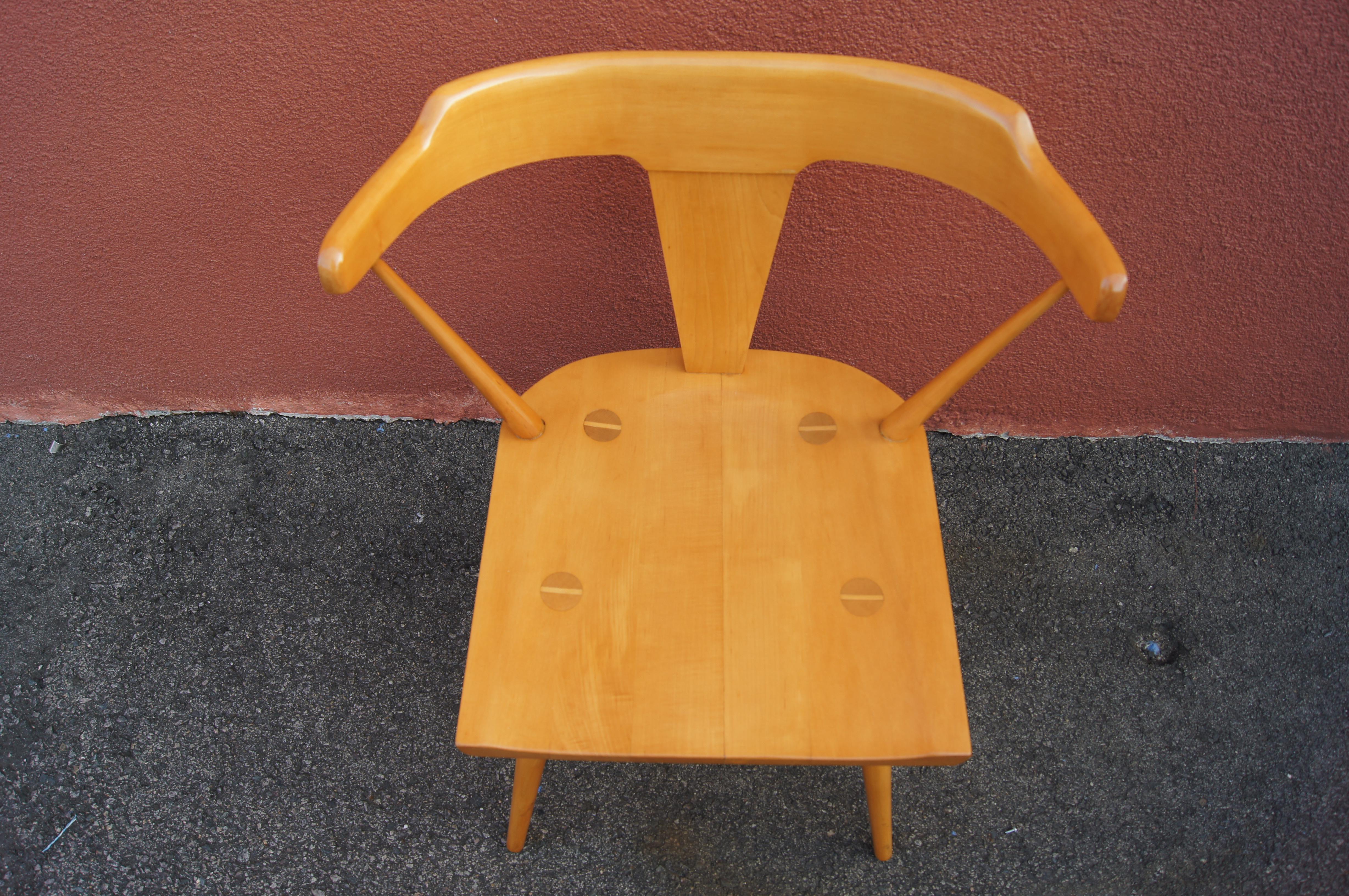 Paul McCobb designed these solid maple dining chairs, model 1530, for Winchendon's Planner Group line. The seats feature exposed leg joinery. The tapered legs continue the lines of the spindles on either side of the expressive T-back frame.
       