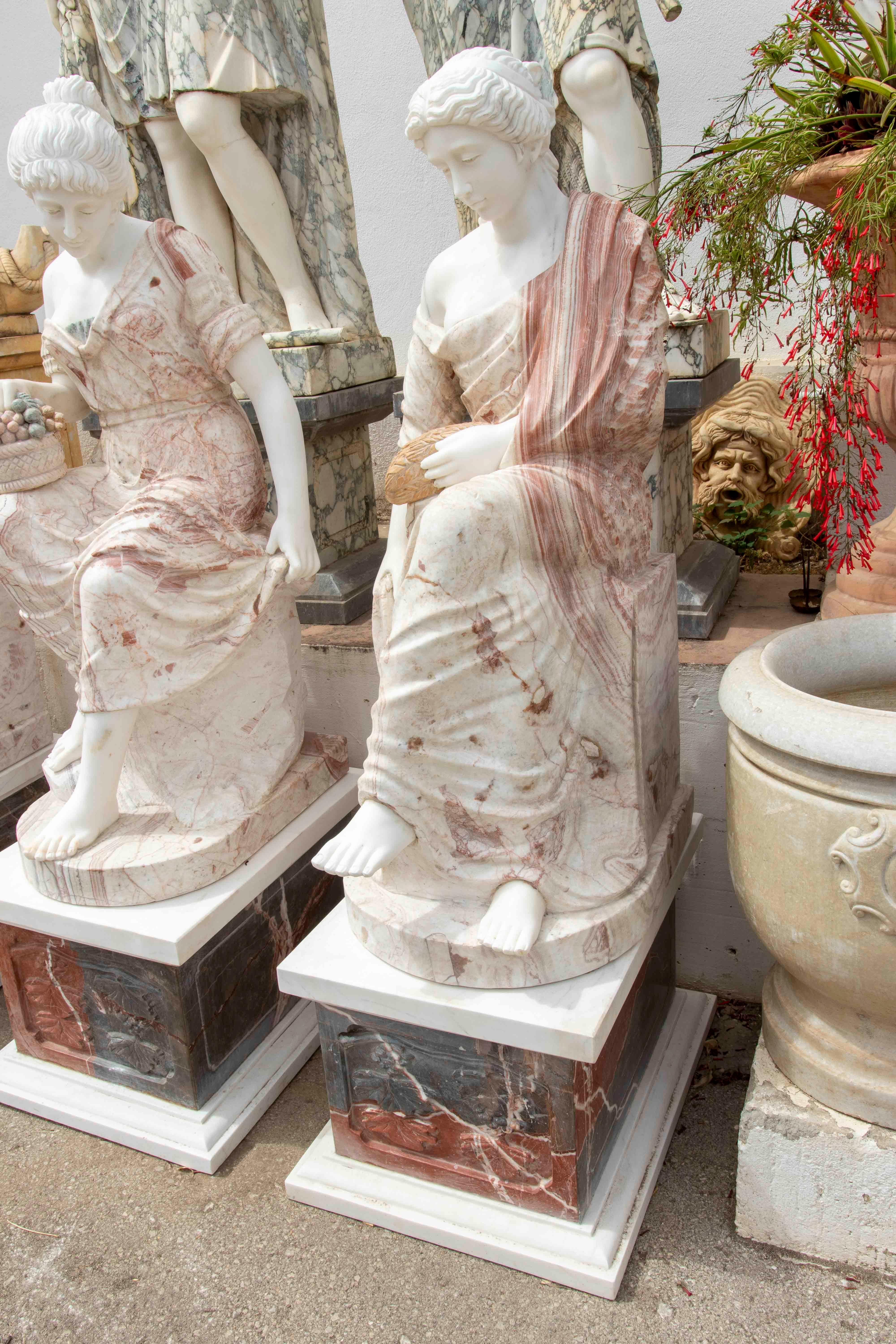 European Set of Four Marble Sculptures of Seated Classical Ladies with Pedestals For Sale