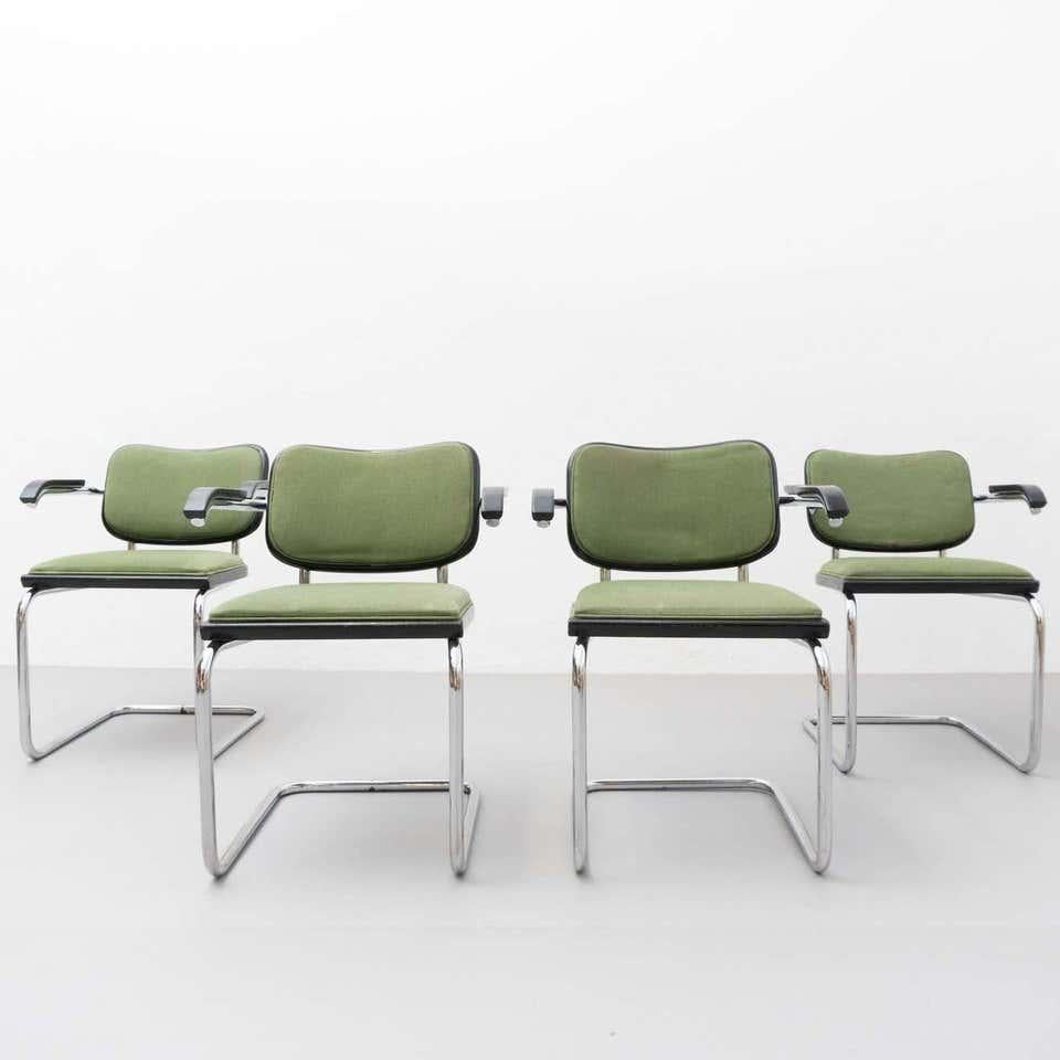 Set of four armchairs, model Cesca, designed by Marcel Breuer.
Manufactured by Gavina, circa 1970.

Metal pipe frame, seat and back with new upholstery added later.
Originally was seat and backrest if rattan.

In good original condition, with
