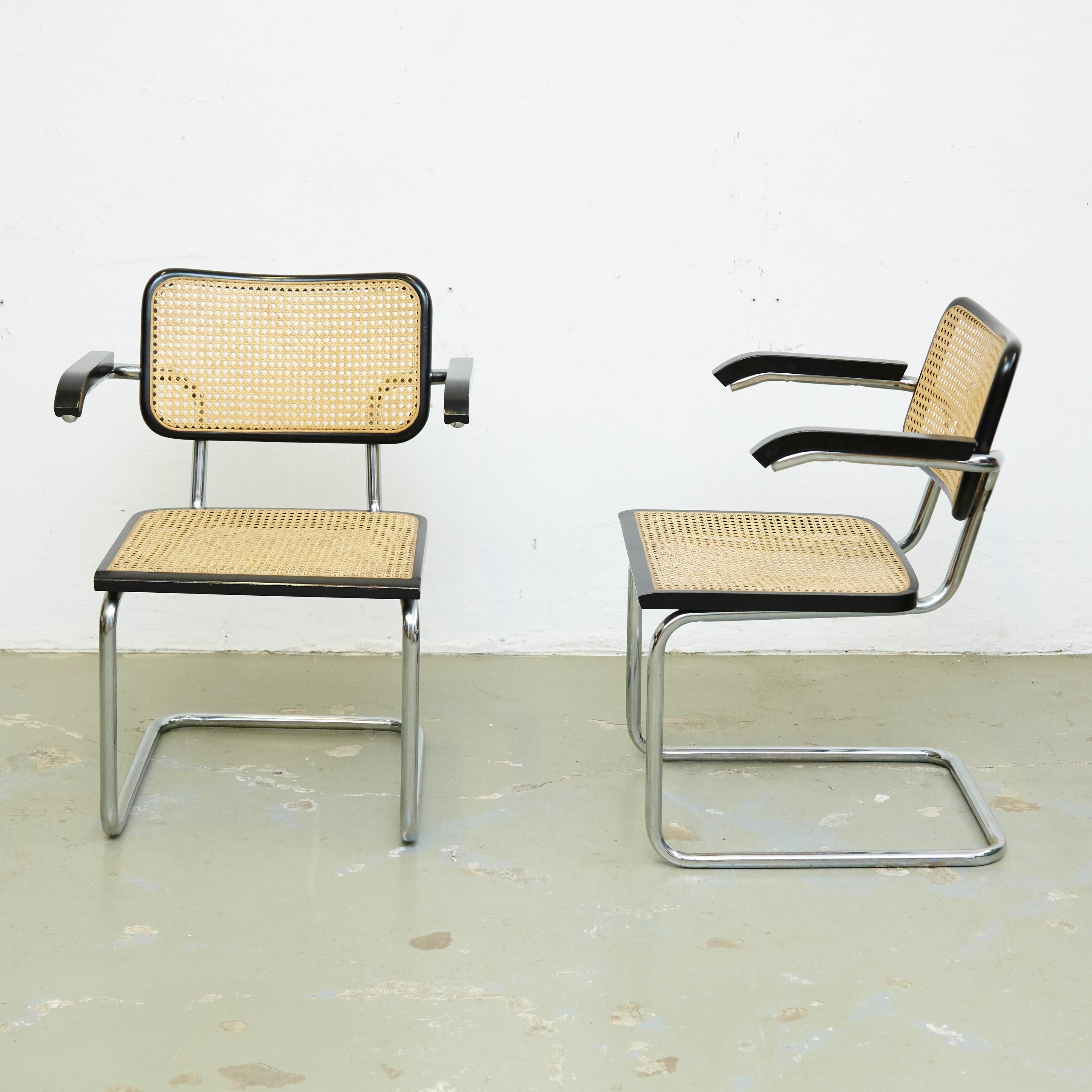 Set of four armchairs, model Cesca, designed by Marcel Breuer.
Manufactured in Italy circa 1970 by unknown manufacturer.

Metal pipe frame, wood seat and back structure and rattan.

In good original condition, with minor wear consistent with