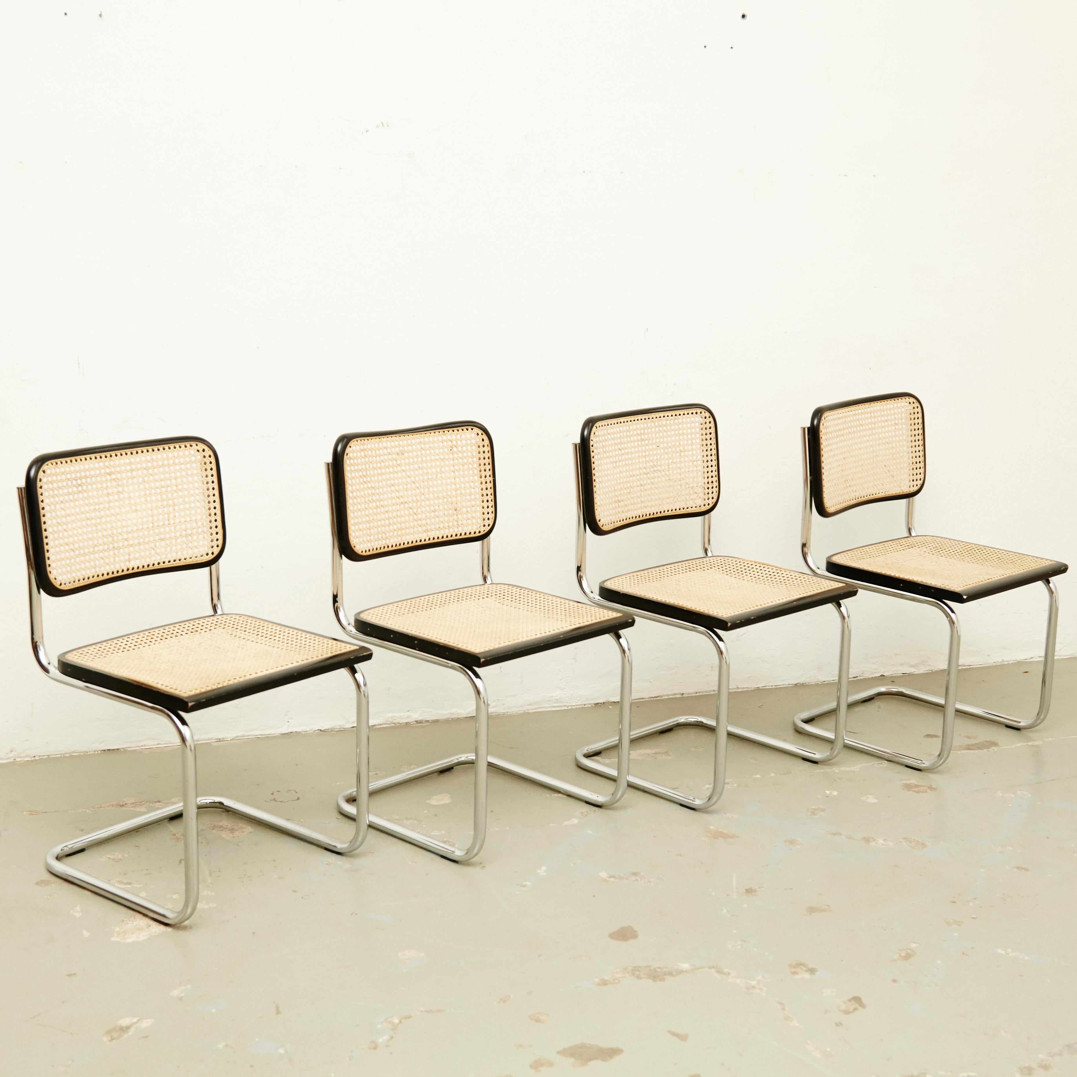 Set of four chairs, model Cesca, designed by Marcel Breuer.
Manufactured in Italy circa 1970 by unknown manufacturer.

Metal pipe frame, wood seat and back structure and rattan.

In good original condition, with minor wear consistent with age