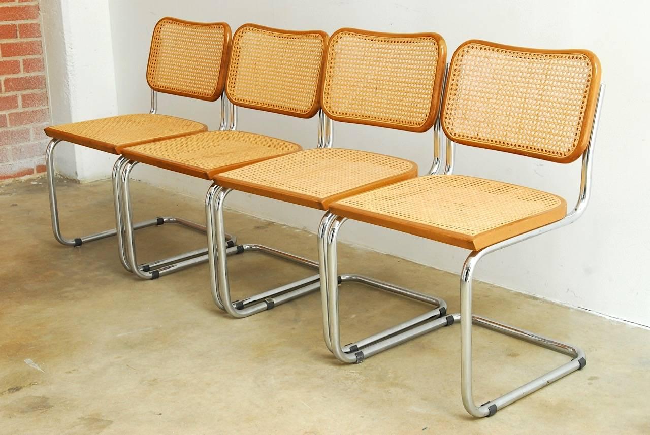 Fabulous set of four Italian cane and chrome cesca chairs by Marcel Breuer. Produced by Gavina in Italy and stamped on seat bottoms. These chairs feature the iconic cantilevered chrome tubular frames with caned seats and backs. Functional, simple,