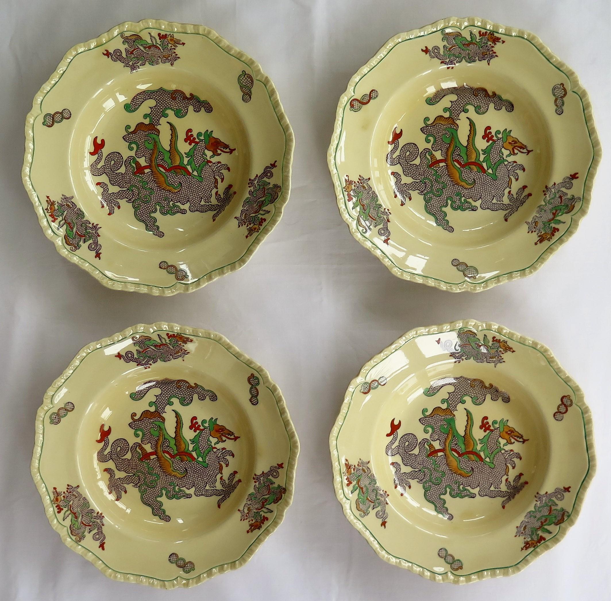 This is a lovely set of four large bowls or deep plates by Mason's Ironstone, England in the Chinese Dragon pattern, dating to the late 19th century, circa 1900.

The plates or bowls are circular in shape with a wavy molded edge.

The bowls are