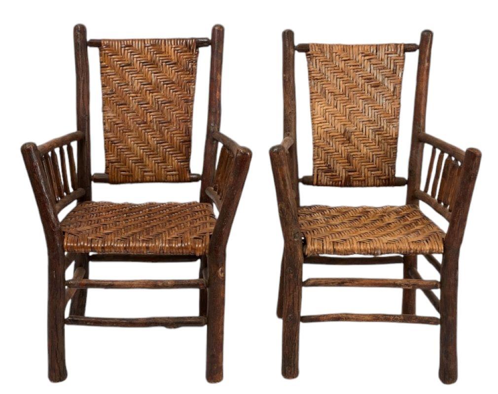 Set of four Old hickory Rockers. In very good condition original cane front and back. Wonderful aged patina & condition.

Arm chairs: H 35-3/4