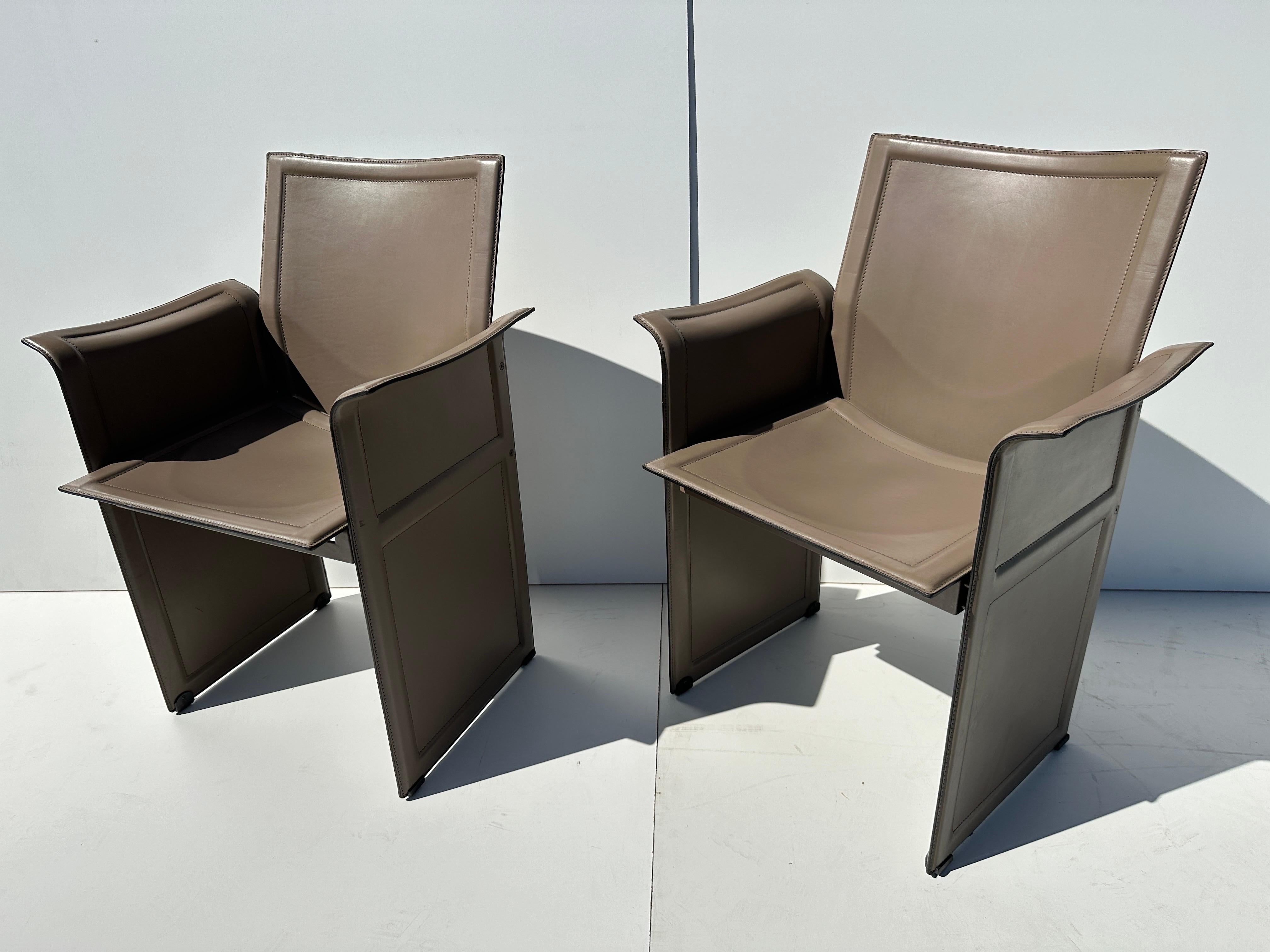 Set of four Tito Agnoli stitched leather  armchairs for Matteo Grassi .
Normal wear and patina. Arm is 25