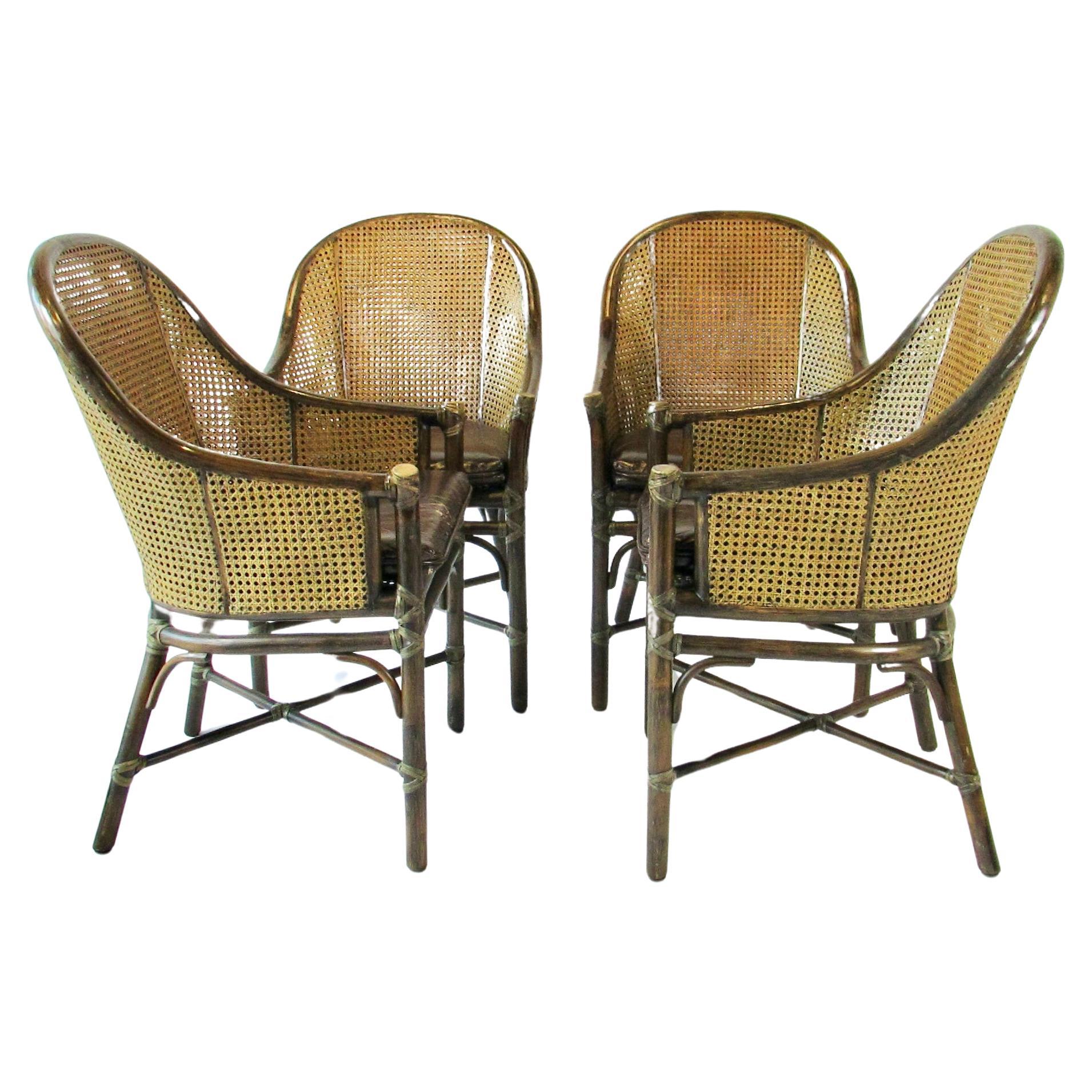Set of four McGuire Bamboo with cane leather seat Belden dining chairs For Sale