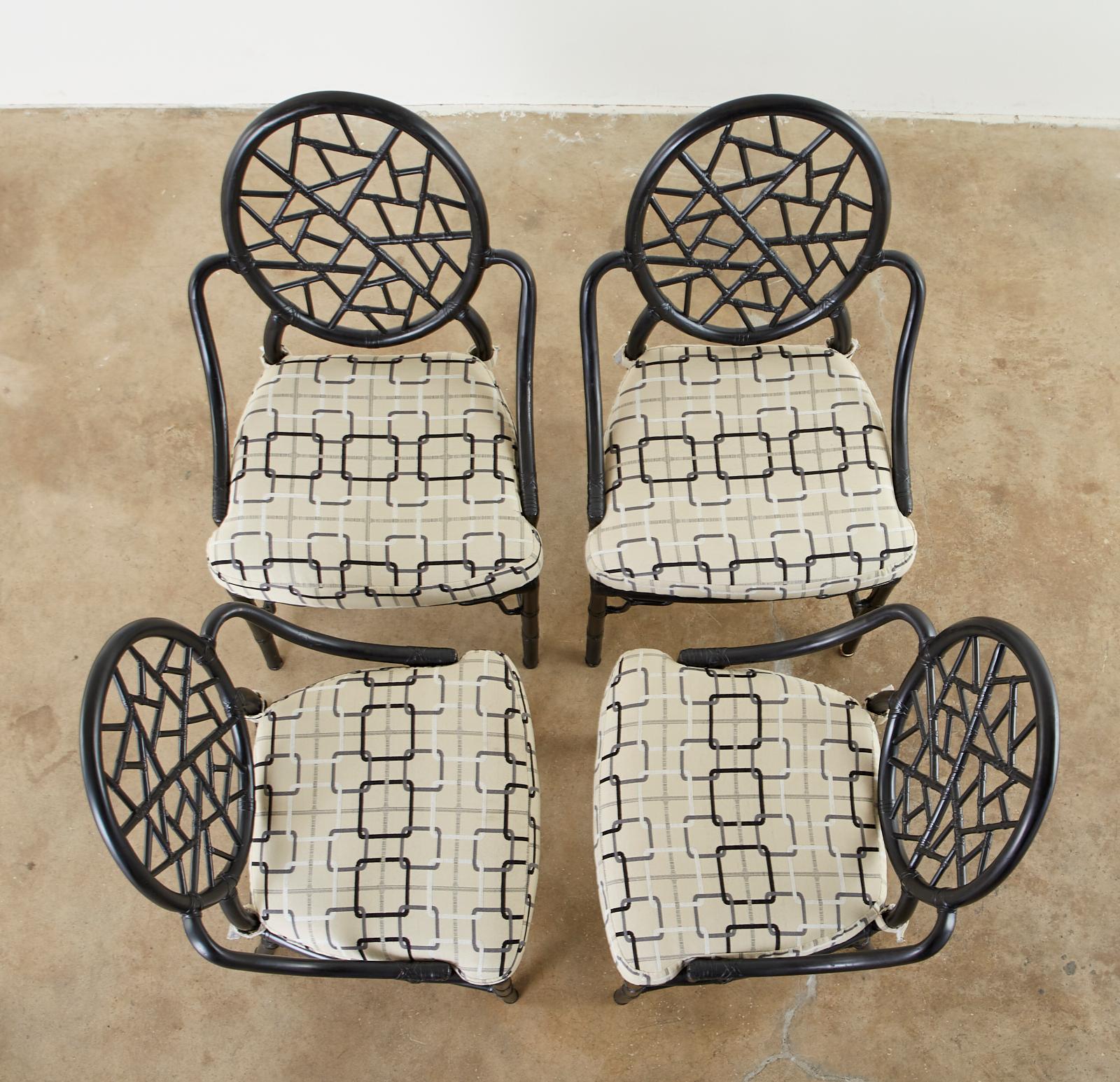 Genuine, authentic set of four California organic modern style bamboo rattan dining chairs made by McGuire. Designed by Elinor McGuire in 1968. The chair is known for its iconic 