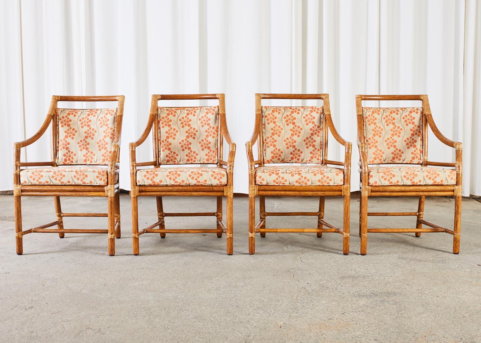 Extraordinary set of four rattan dining armchairs crafted in the California organic modern style. The iconic 