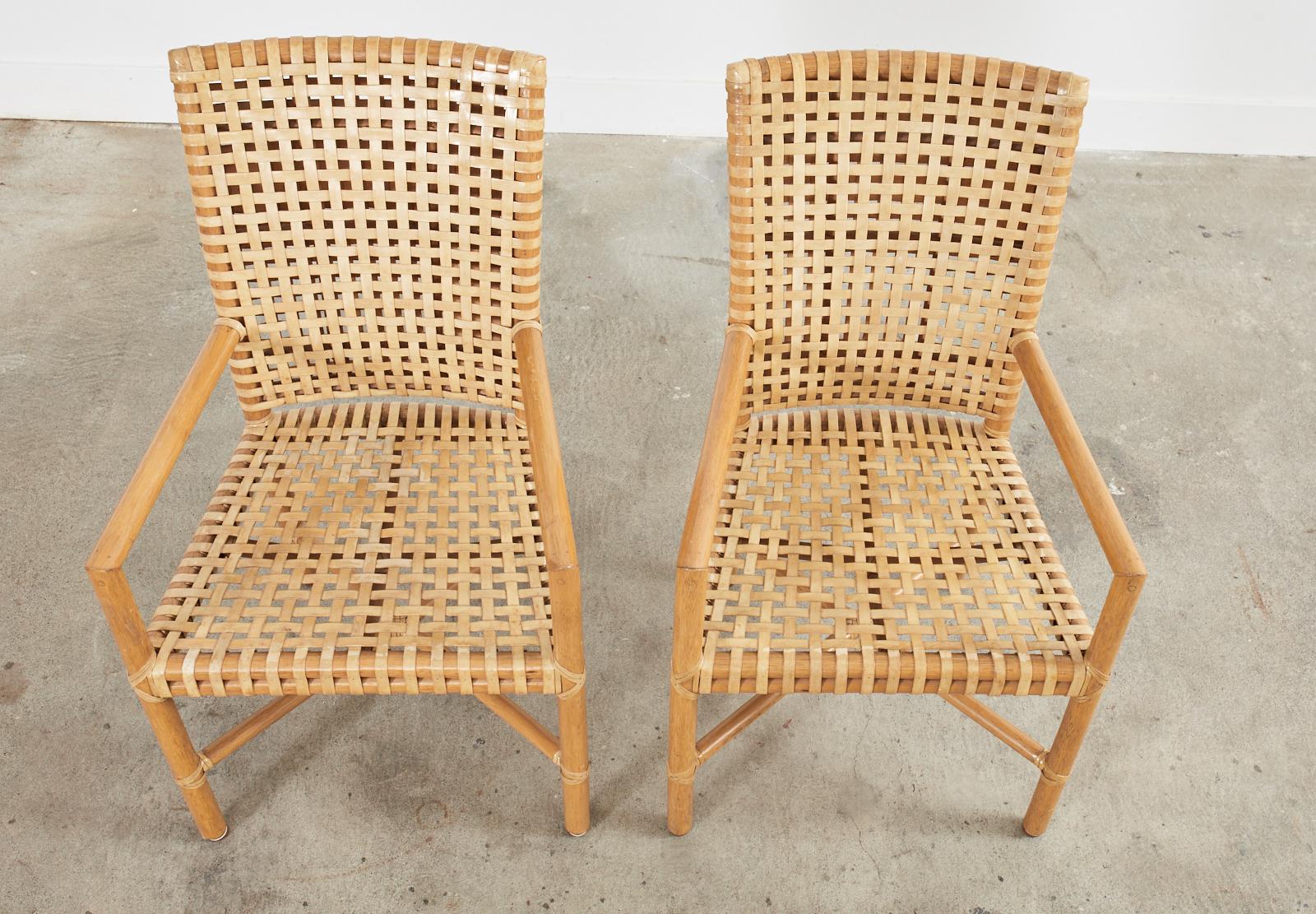 Hand-Crafted Set of Four McGuire Woven Rawhide Rattan Dining Armchairs For Sale