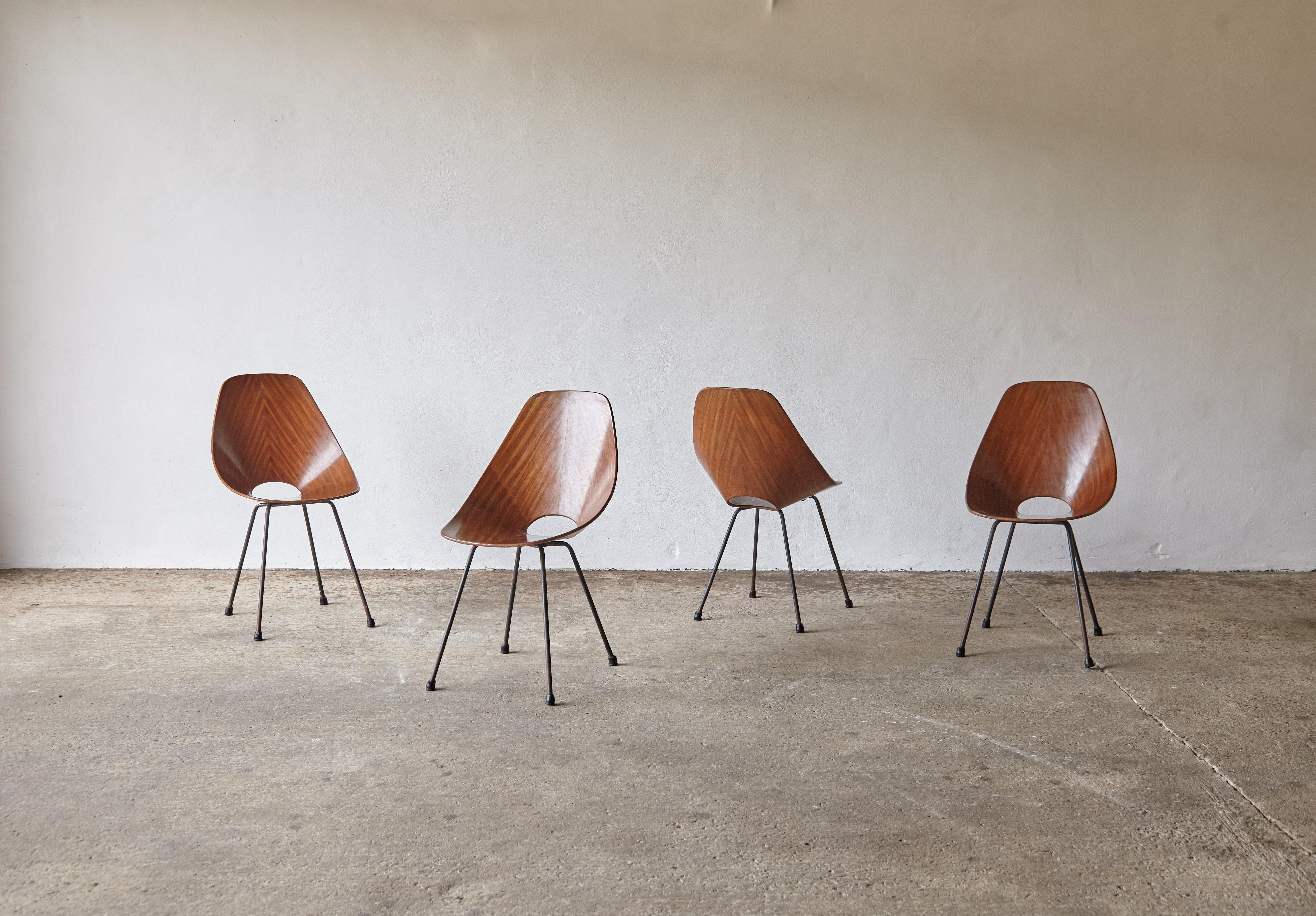 An authentic and original set of six Medea chairs by Vittorio Nobili for Fratelli Tagliabue, Italy, 1950s. Structually solid, with some small old fill repairs to the edges of the wood veneer. Overall a lovely set with great character.   Fast