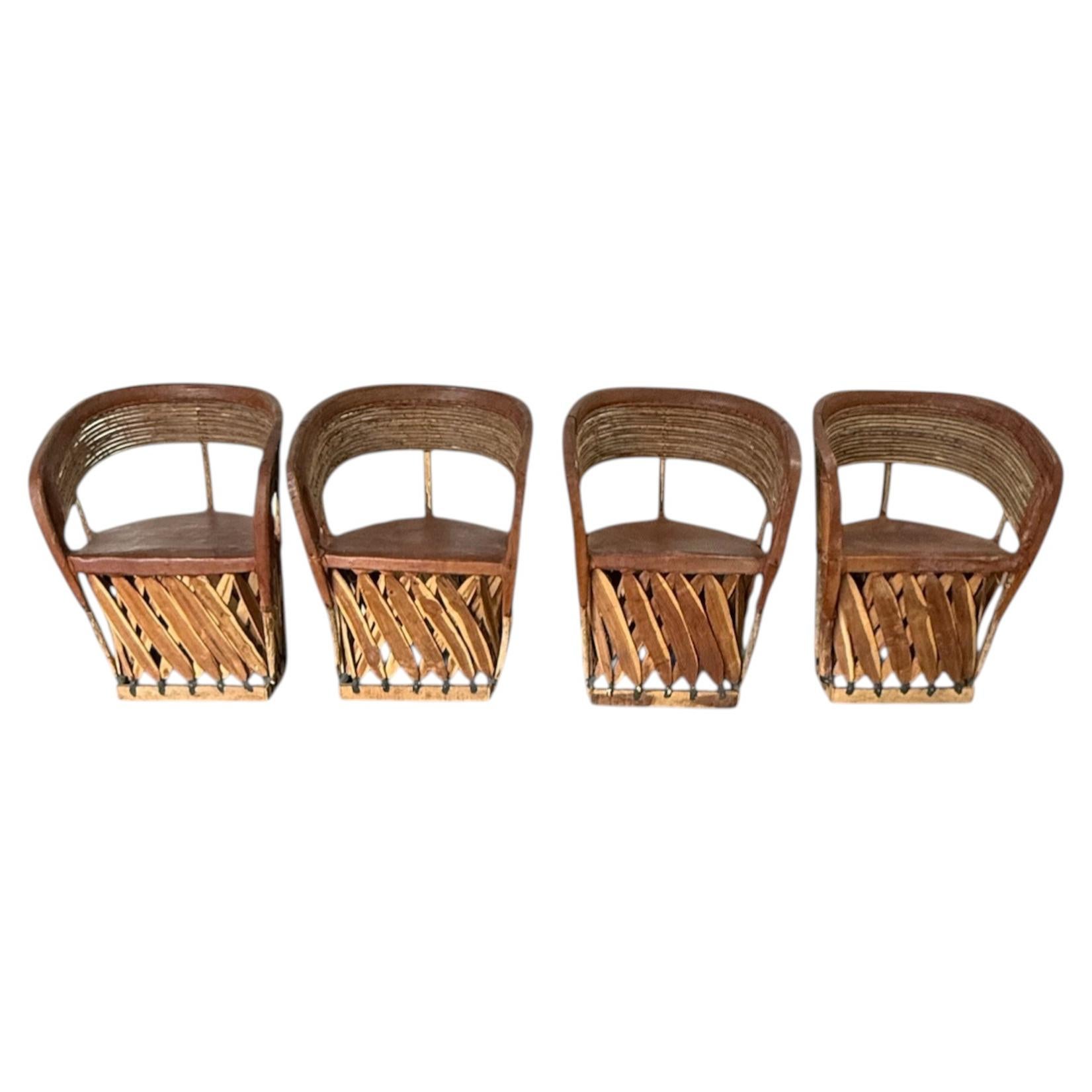 Set of Four Mexican Equipale Folk Art Chairs