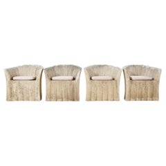Satz von vier Michael Taylor Style Faux Stone Tulip Garden Chairs