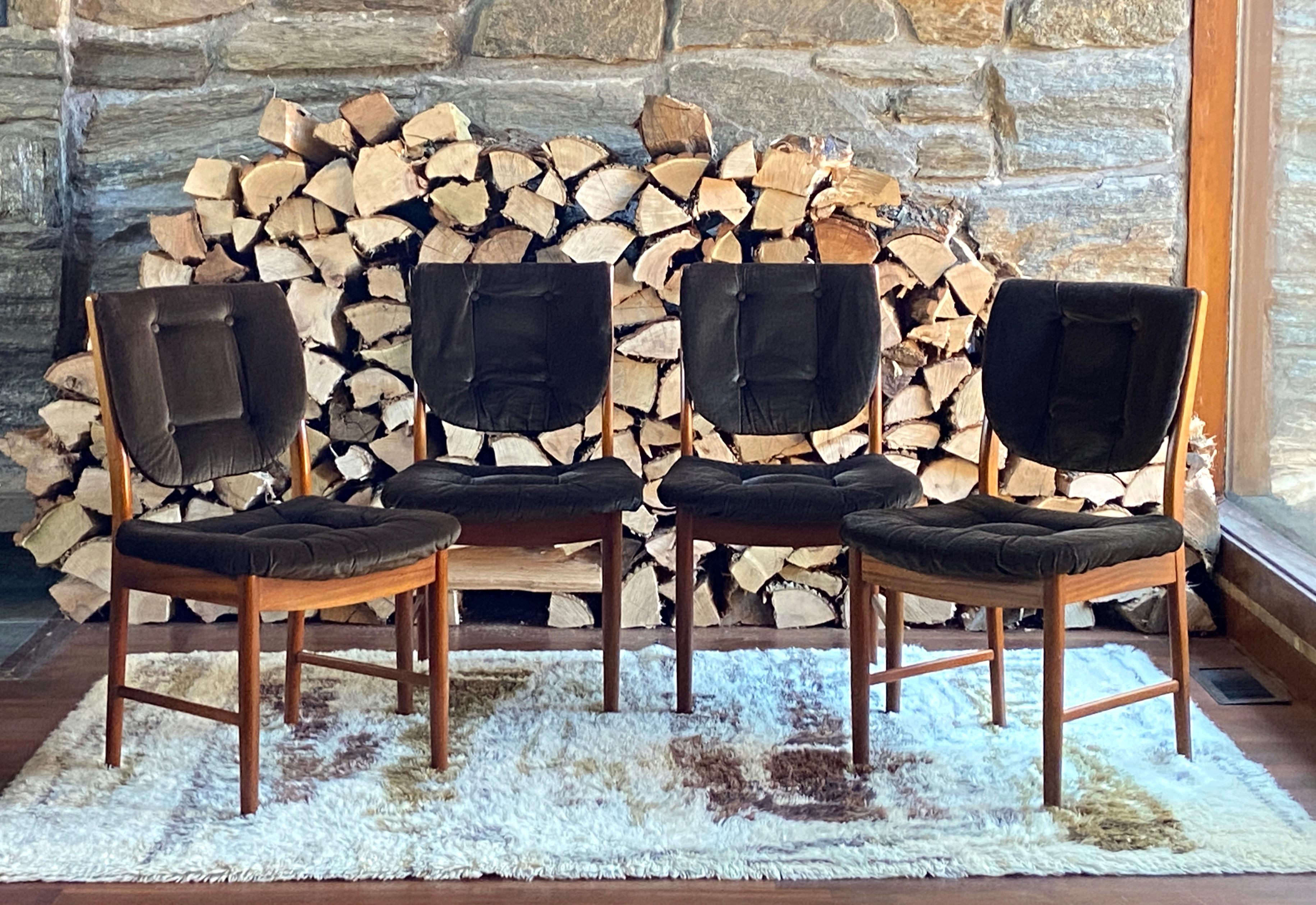Very nice set of four mid century Danish style teak dining chairs made in 1976 in Scotland by A.H. Mcintosh - known for their high quality credenzas, but their dining chairs are somewhat rare. Nice tufted deep brown velvet upholstery on well crafted