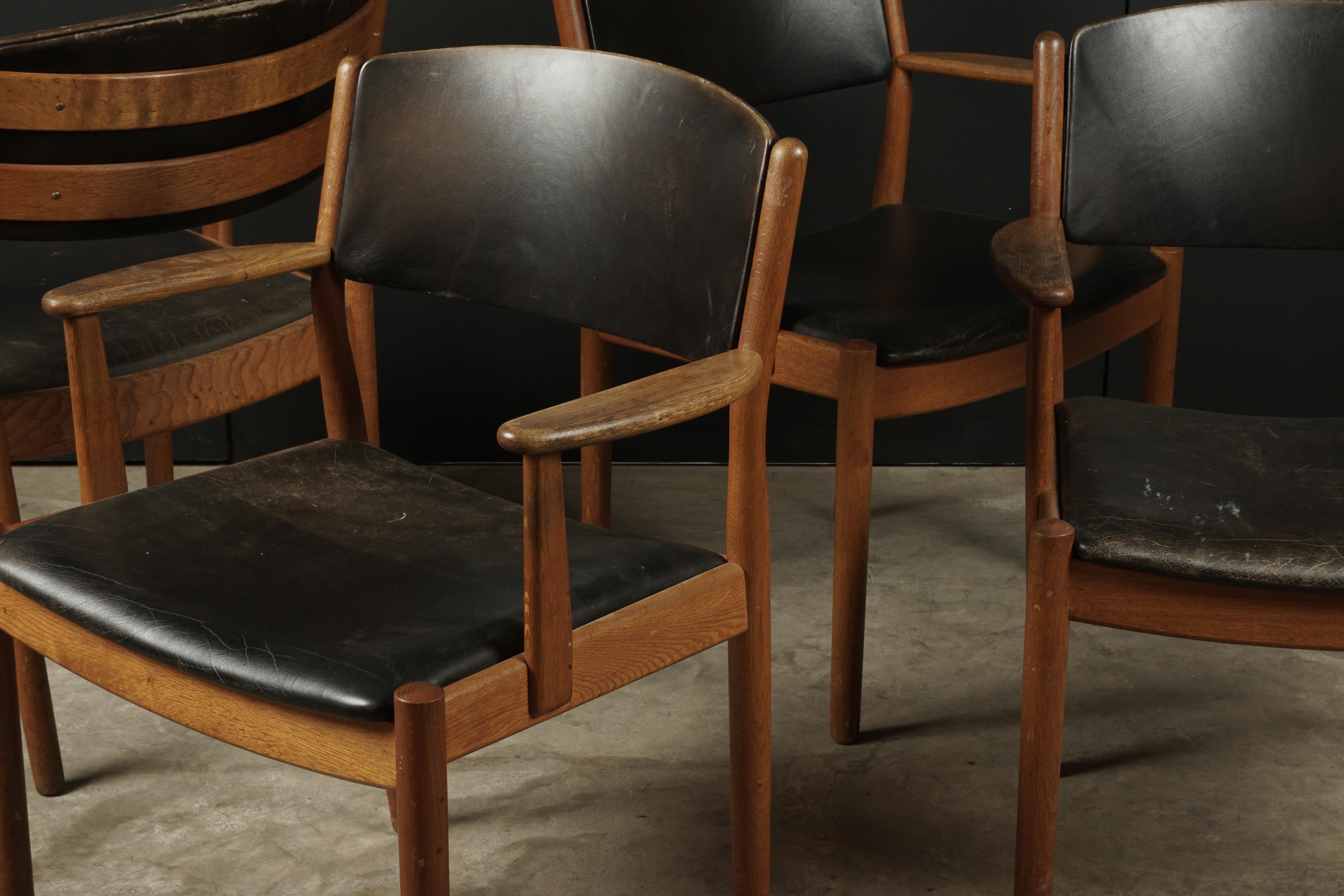 Set of four midcentury armchairs by Poul Volther for FDB Møbler, 1950s. Original black leather upholstery with nice patina and wear.