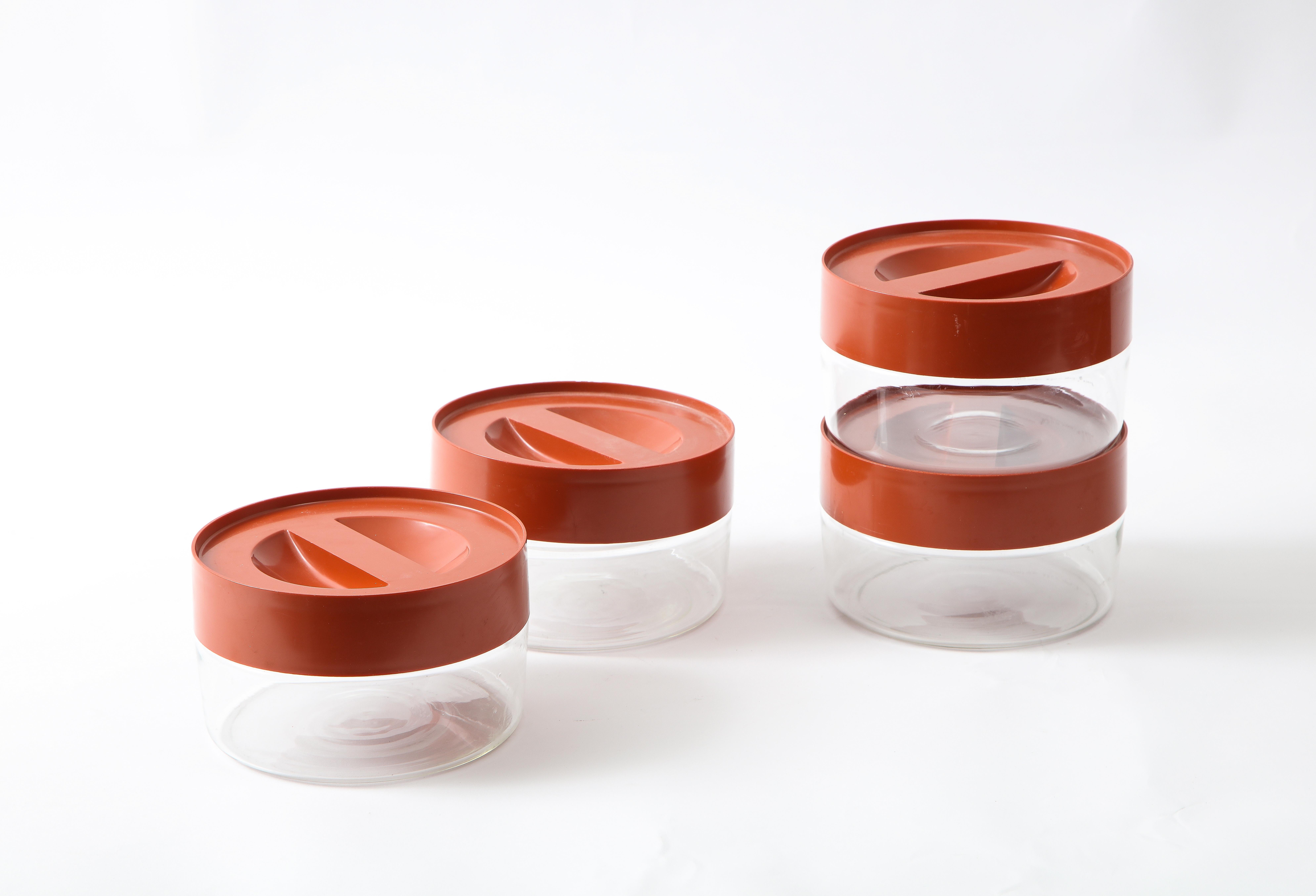 Glass Set of Four Mid-Century Stackable Storage Containers with Burnt Orange Lids For Sale