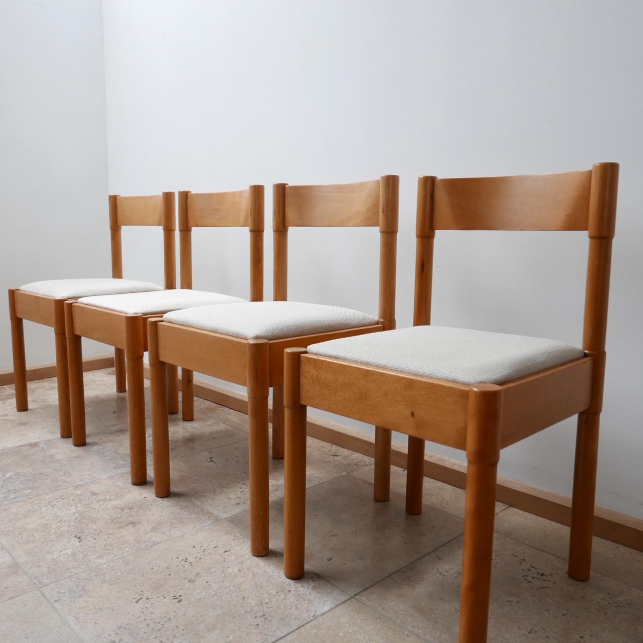 A set of four mid-century dining chairs. 

Beech wood re-upholstered in Italian Linen. 

Likely Danish, c1960s. 

Probably retailed through Habitat. 

Some age related knocks and scuffs commensurate with age. 

Dimensions: 42 W x 43 D x