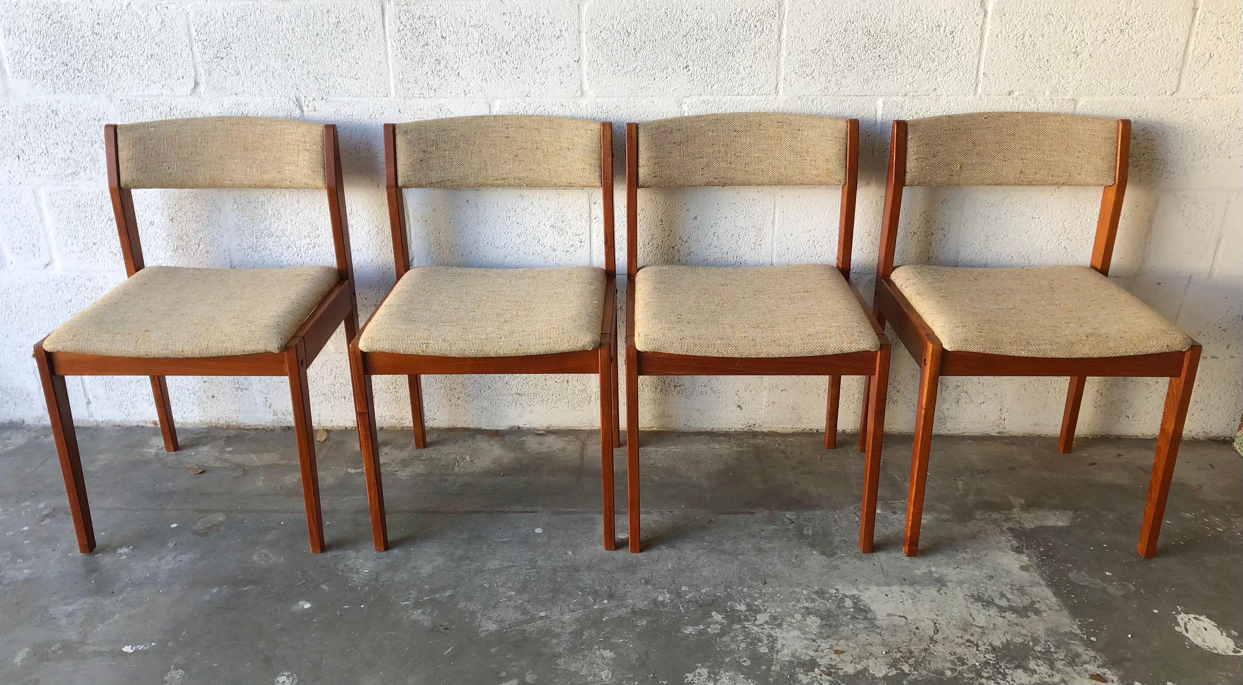A set of four vintage mid century danish modern upholstered dining chairs by Tarm Stole OG Mobelfabrik Denmark. Circa 1970s. 
Feature sleek teaks frame with a beautiful wood grain and the original neutral colors upholstery. 
All the chairs are in