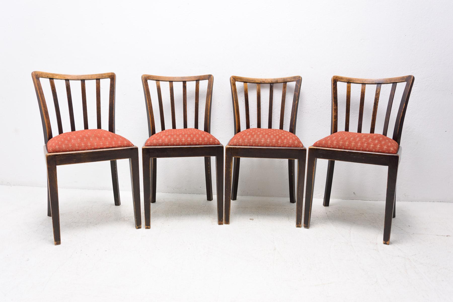 Set of four dining chairs by Thonet, these were made in the former Czechoslovakia in the 1950's . Made of beech wood and upholstered in fabric. The chairs are in good Vintage condition, with wear appropriate for the age of chairs. Marked Thonet.