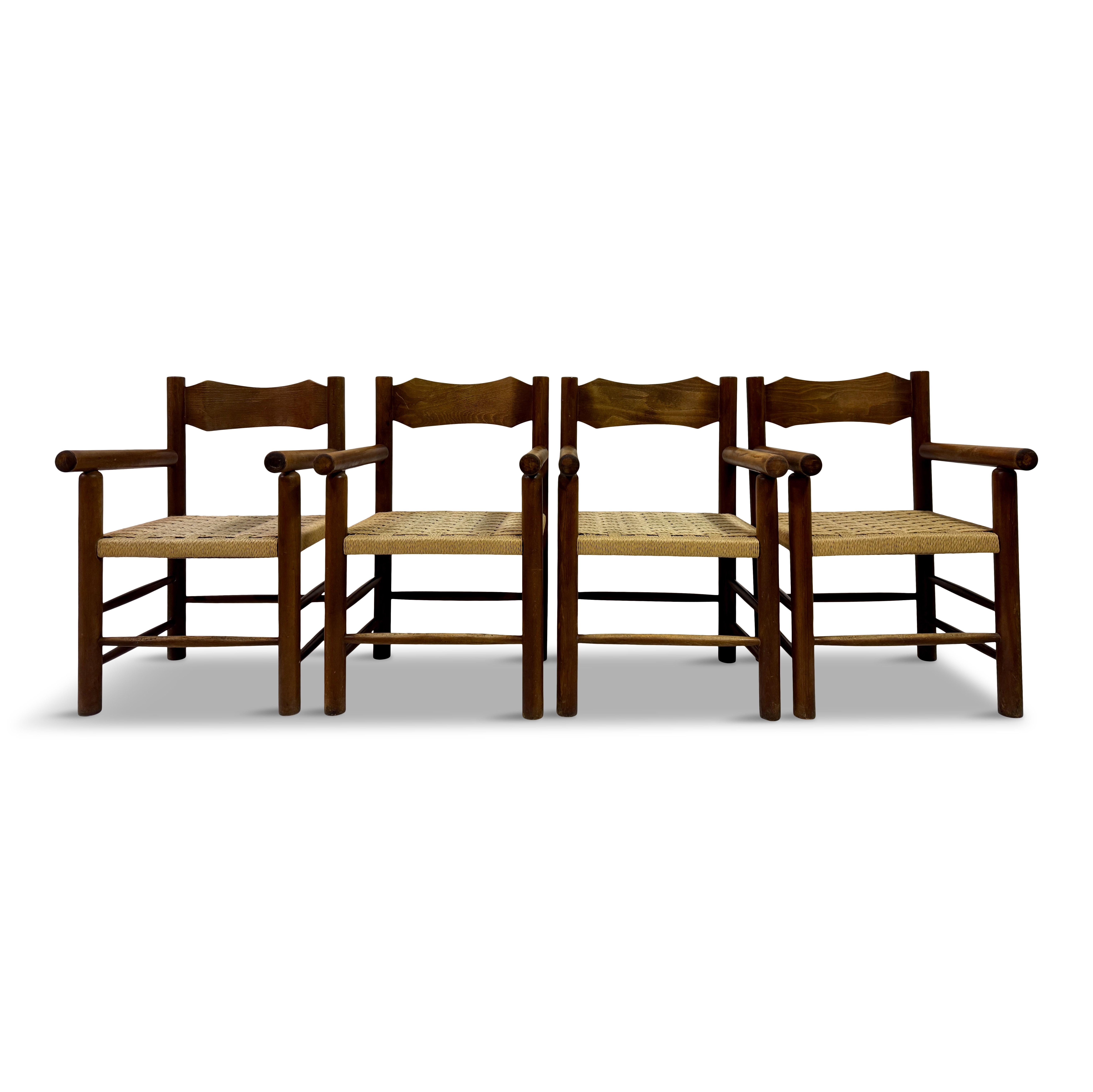 Set of Four Mid-Century Italian Armchairs with Rope Seats

Robust yet inviting, this set of four Italian armchairs captures the honest charm of mid-century rural craftsmanship. Each chair is crafted from solid wood with rounded dowel legs and arms,