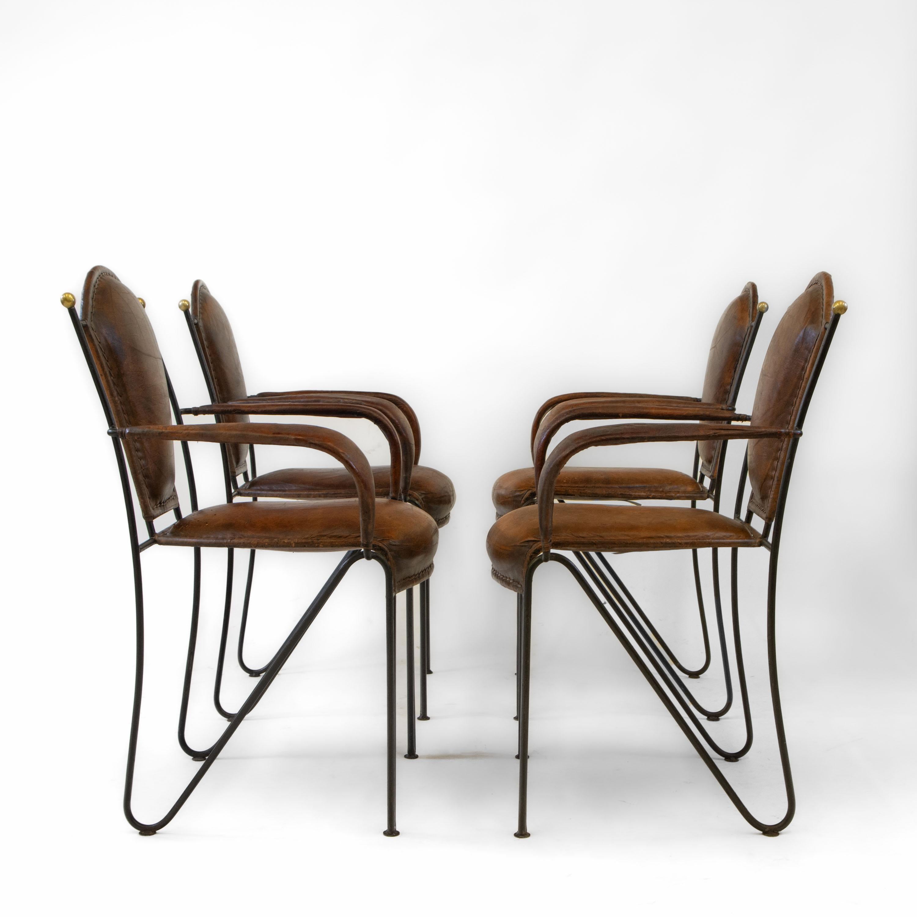 Fabulous set of four mid century French leather & iron dining chairs. Circa 1950’s.

I also have these chairs available as sets of two, should you not require all four. Please do look at these listings for more photographs.

The chairs have brass