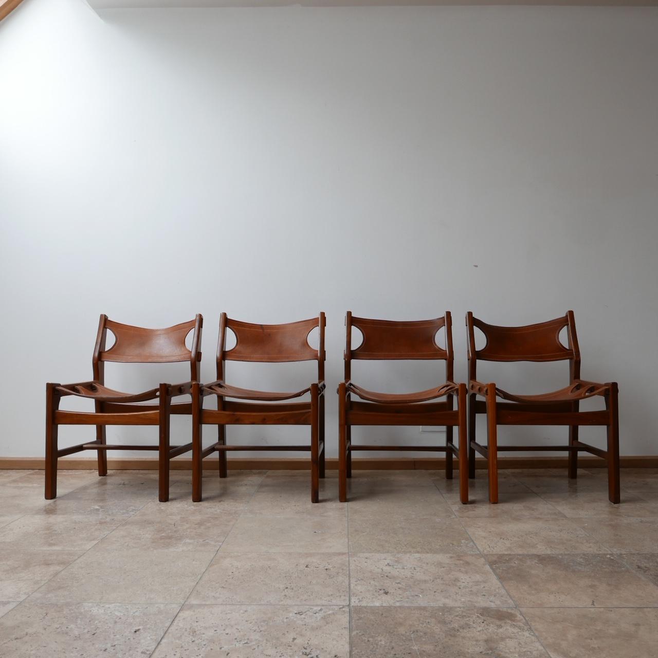 A set of four dining chairs in manner of Sergio Rodrigues.

With strong design links to Sergio Rodrigues, Brazil, these chairs however are likely to be continental, perhaps Spanish. 

Good quality and stylish,

Spain, c1960s. 

The leather