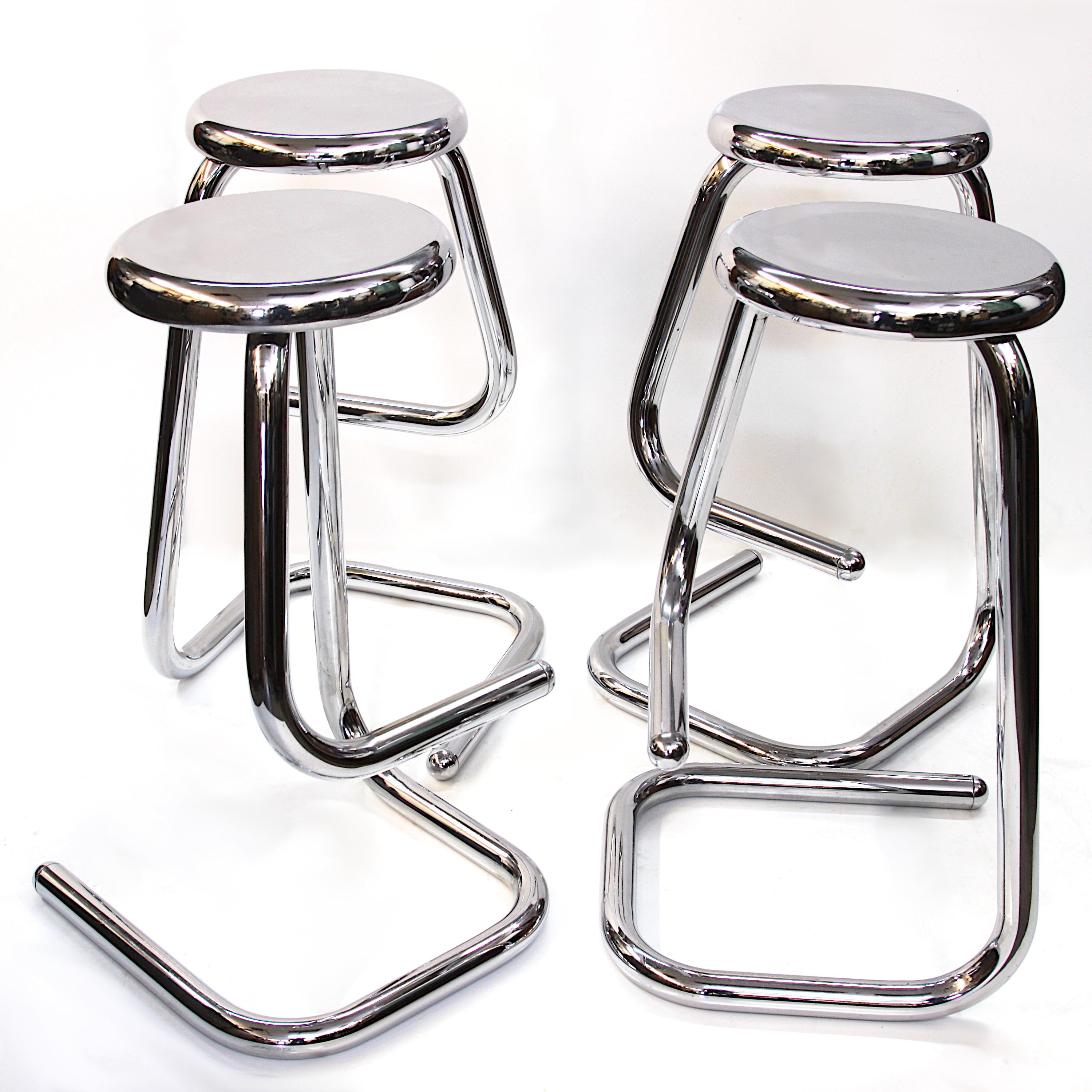Mid century set of 4 chrome Paperclip bar stools for Kinetics. Designed by Phillip Salmon, Hugh Hamilton and Rein Soosalu, the K700 stool was first produced in 1969. It is the most famous design of Salmon & Hamilton’s three-year partnership and was