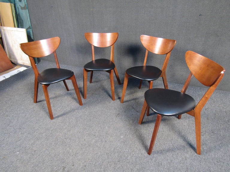 Full of understated Mid-Century Modern style, this set of four vintage chairs is a stylish and versatile addition to a dining room. Please confirm item location with seller (NY/NJ).