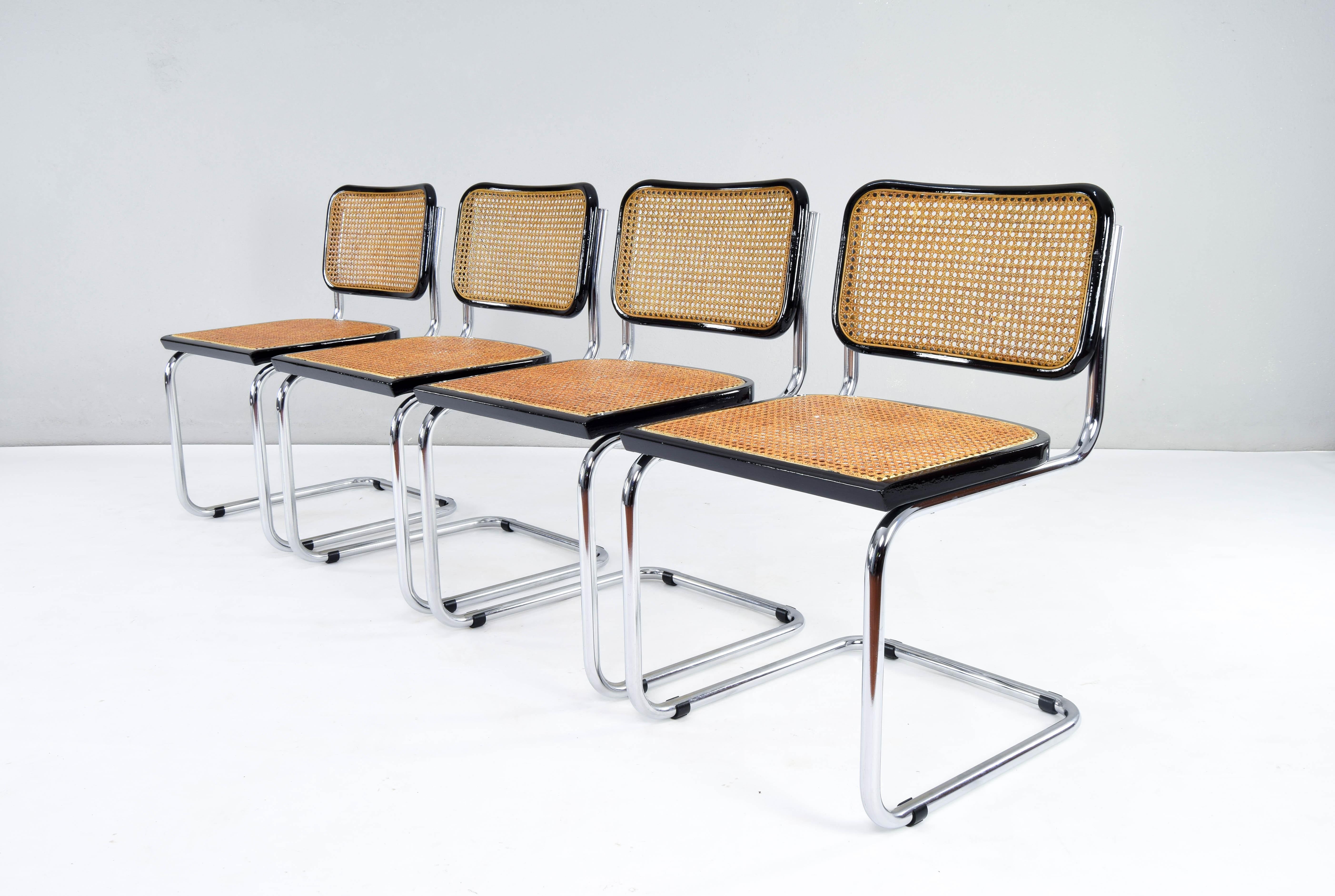 Set of four Cesca chairs, model B32, Italy in the 1970s. This set of 4 chairs are part of a high quality edition.

Chrome tubular structure in very good condition. Beech wood frames lacquered in black and Viennese natural grid. The natural fiber
