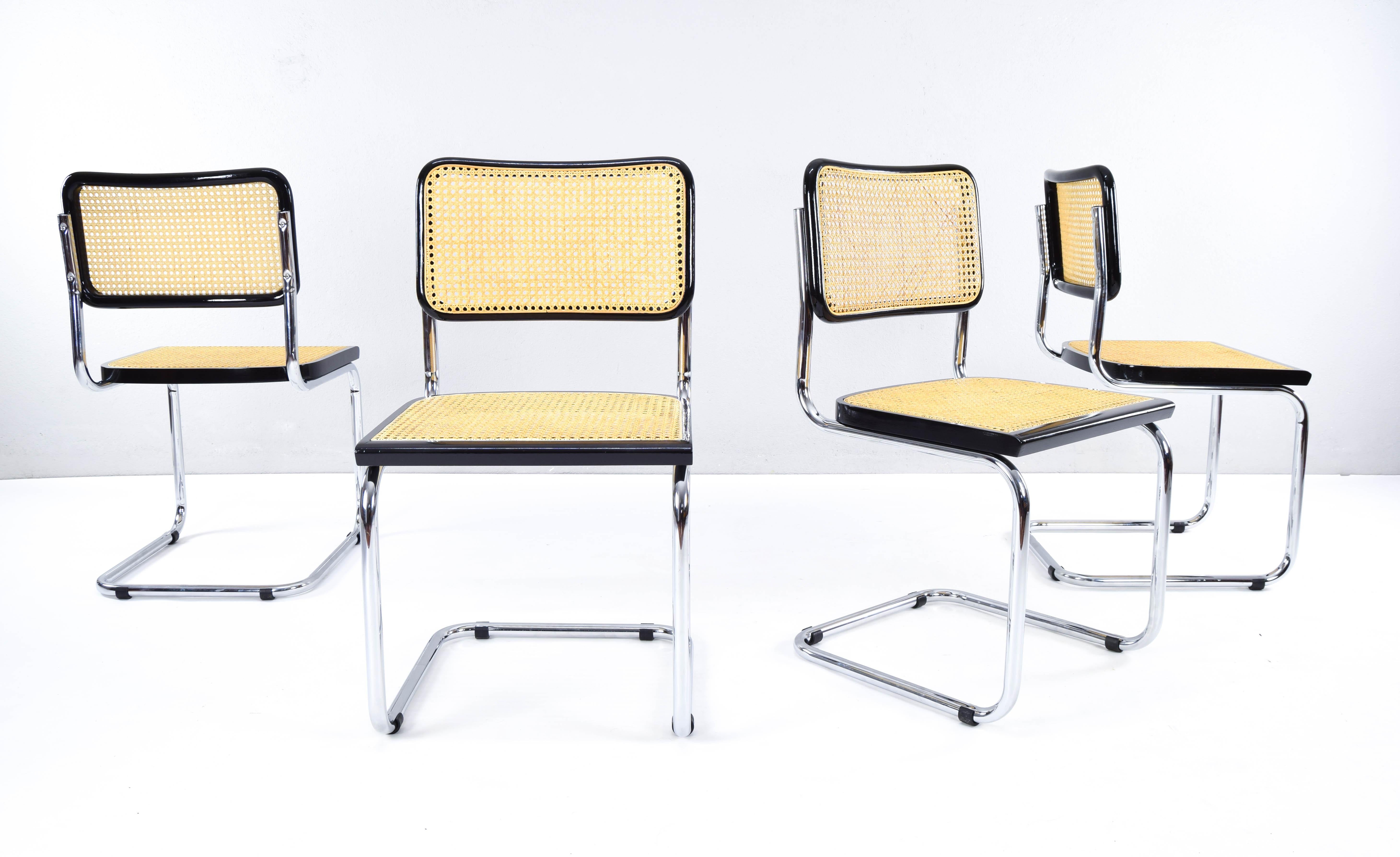 Set of four Cesca B32 chairs, Italy, 1970s.
Chromed tubular chassis in good general condition.
Seat and back structures in black lacquered beech wood and natural Viennese grille.

Measurements:
Overall height 85cm
High seat 45.5 cm
width