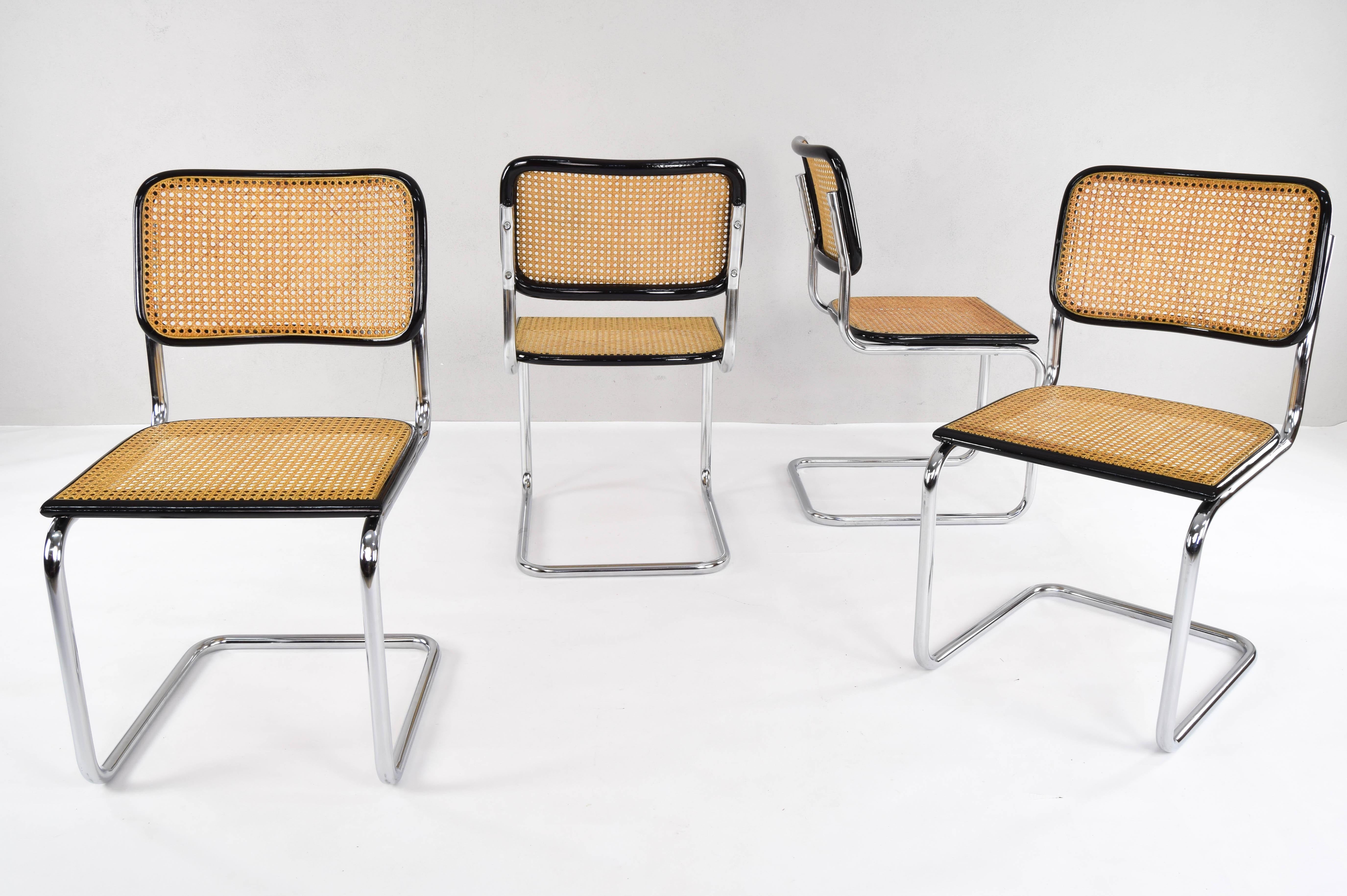 Set of four Cesca chairs, model B32, manufactured in Italy in the 1970s. Chrome tubular structure, beech wood frames lacquered in black and Viennese natural grid.

Measures: 
Total height 84 cm
Seat height 46 cm
Width 46 cm
Depth 52 cm.