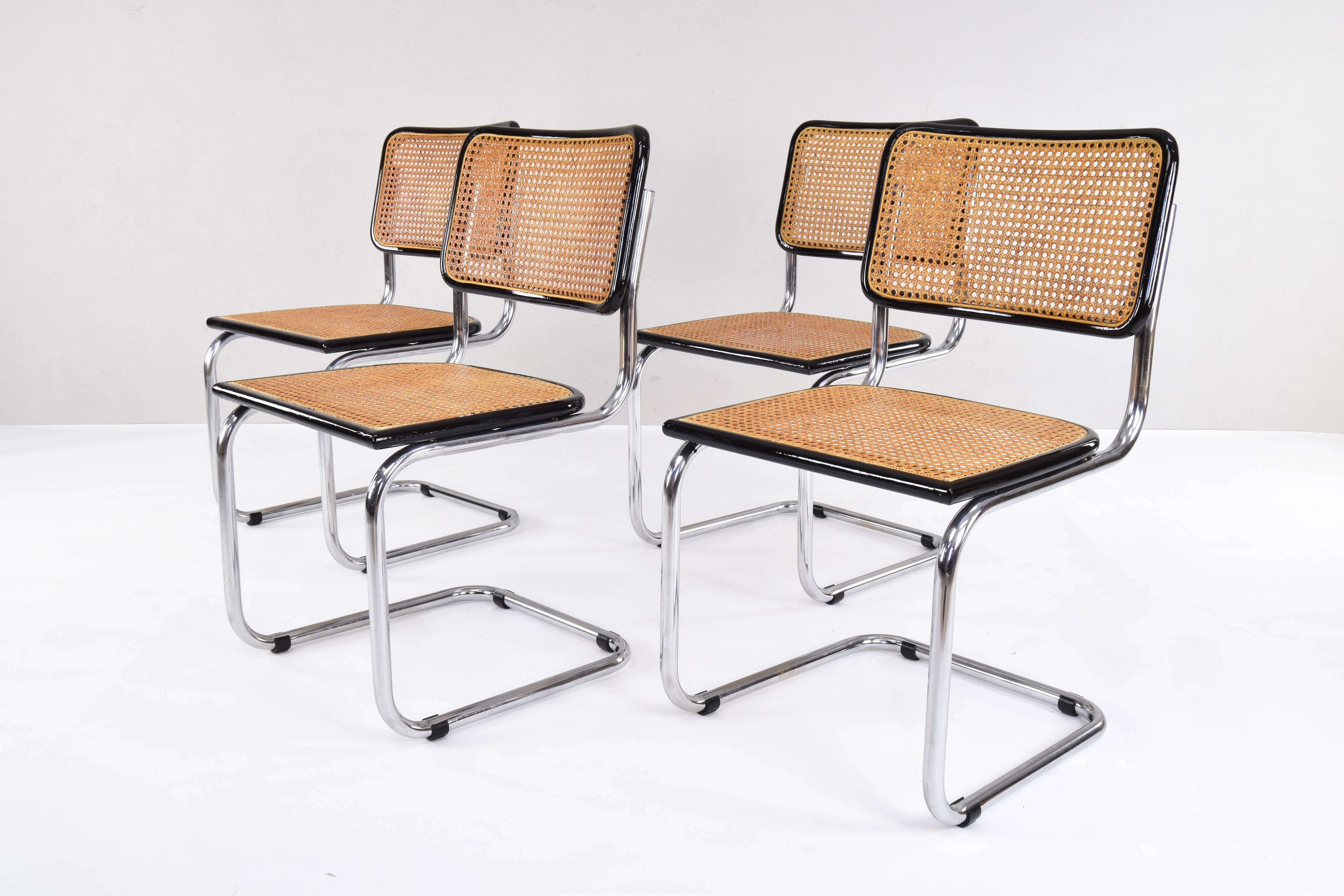 Set of four Cesca chairs, model B32, manufactured in Italy in the 1970s. Chrome tubular structure, beech wood frames lacquered in black and Viennese natural grid.
The grilles of the four seats have been put new.
Excellent condition. Chairs