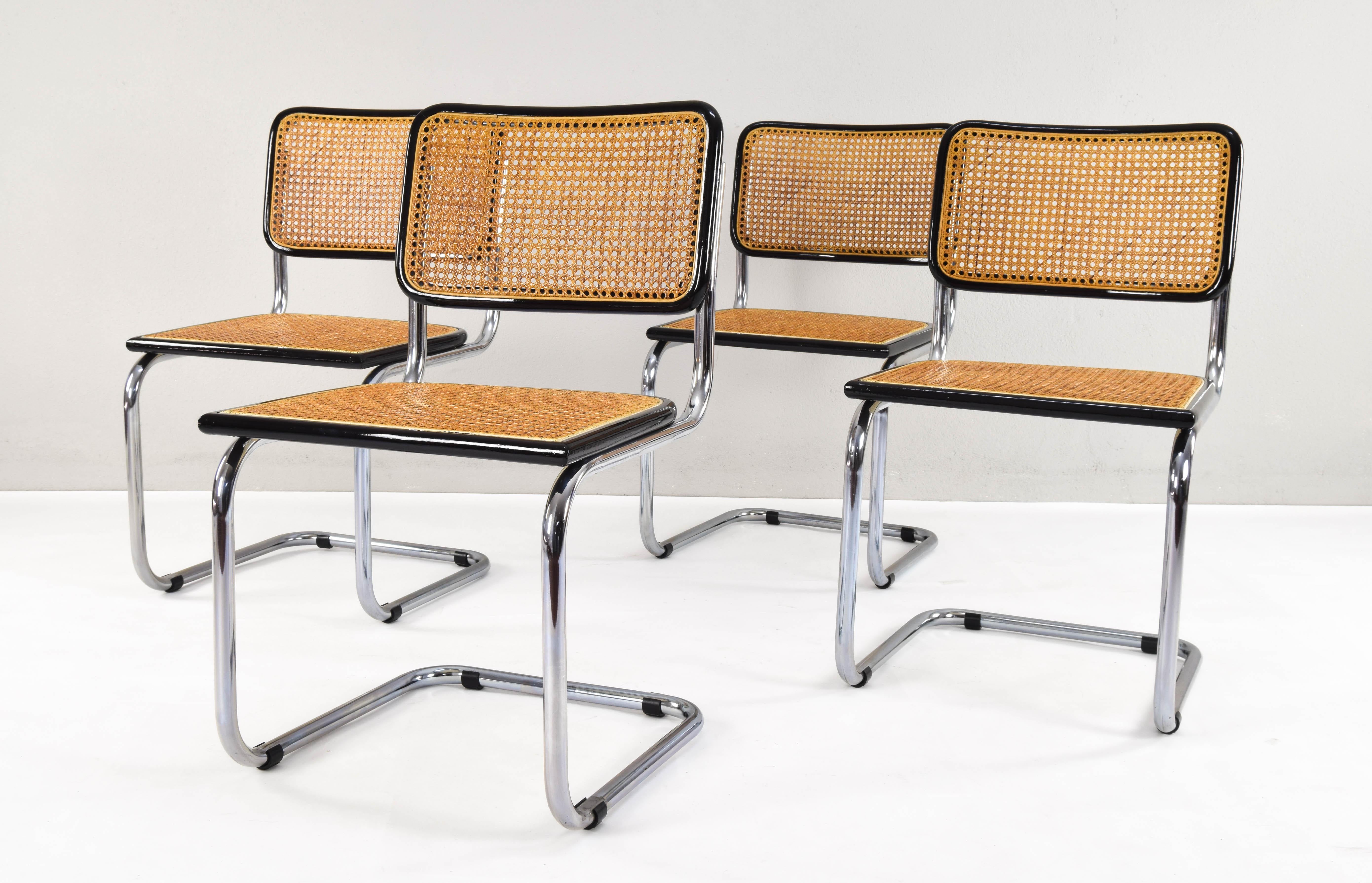 Set of four Cesca chairs, model B32, manufactured in Italy in the 1970s. Chrome tubular structure, beechwood frames lacquered in black and Viennese natural grid.

Only slight flaw in the chrome of the base of two of the chairs detailed in images.