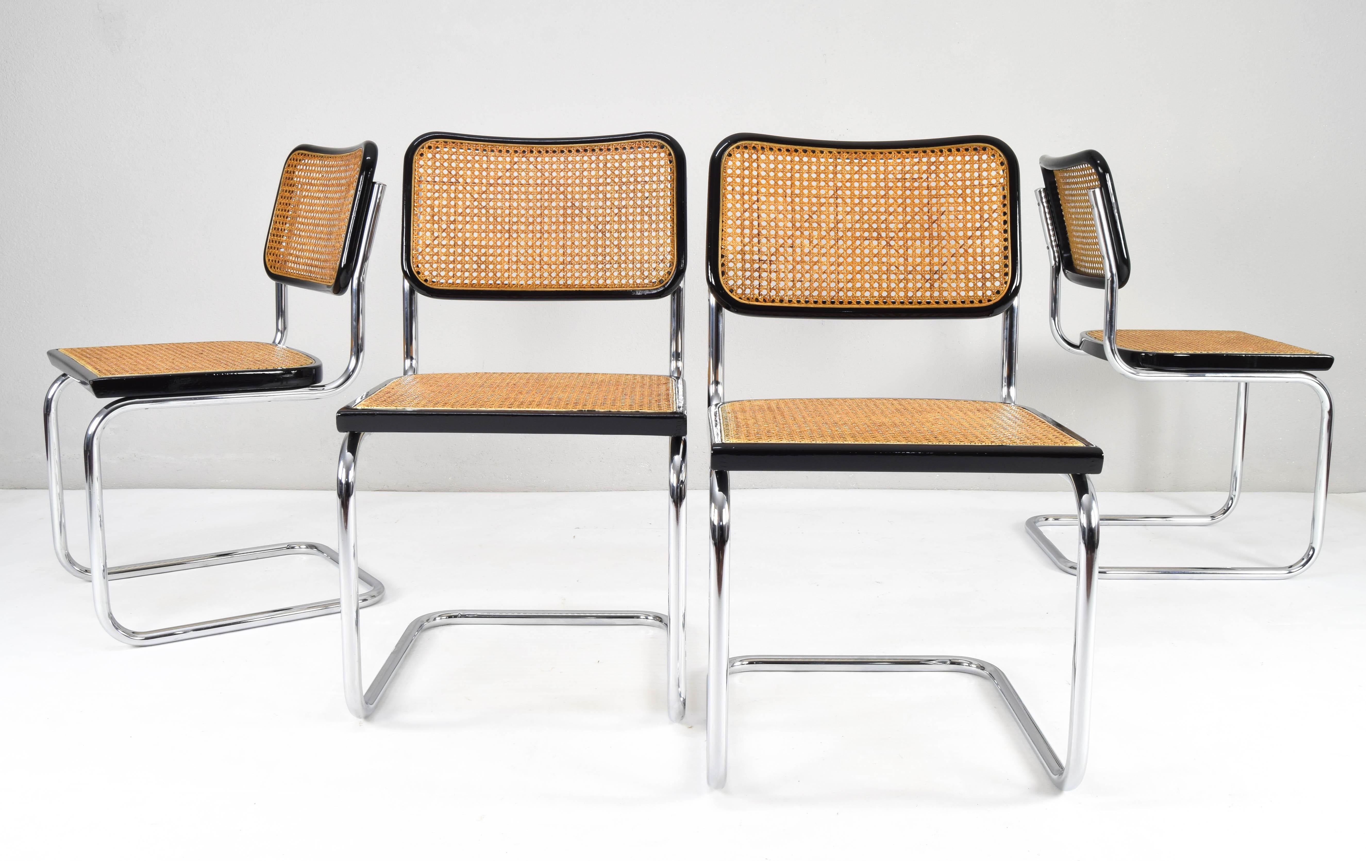 Set of four Cesca chairs, model B32, made in Italy in the 1970s. Very well preserved chromed tubular structure, black lacquered beechwood frames and natural Viennese grille. The grilles of the four seats have been put new.

Measures: 
Total