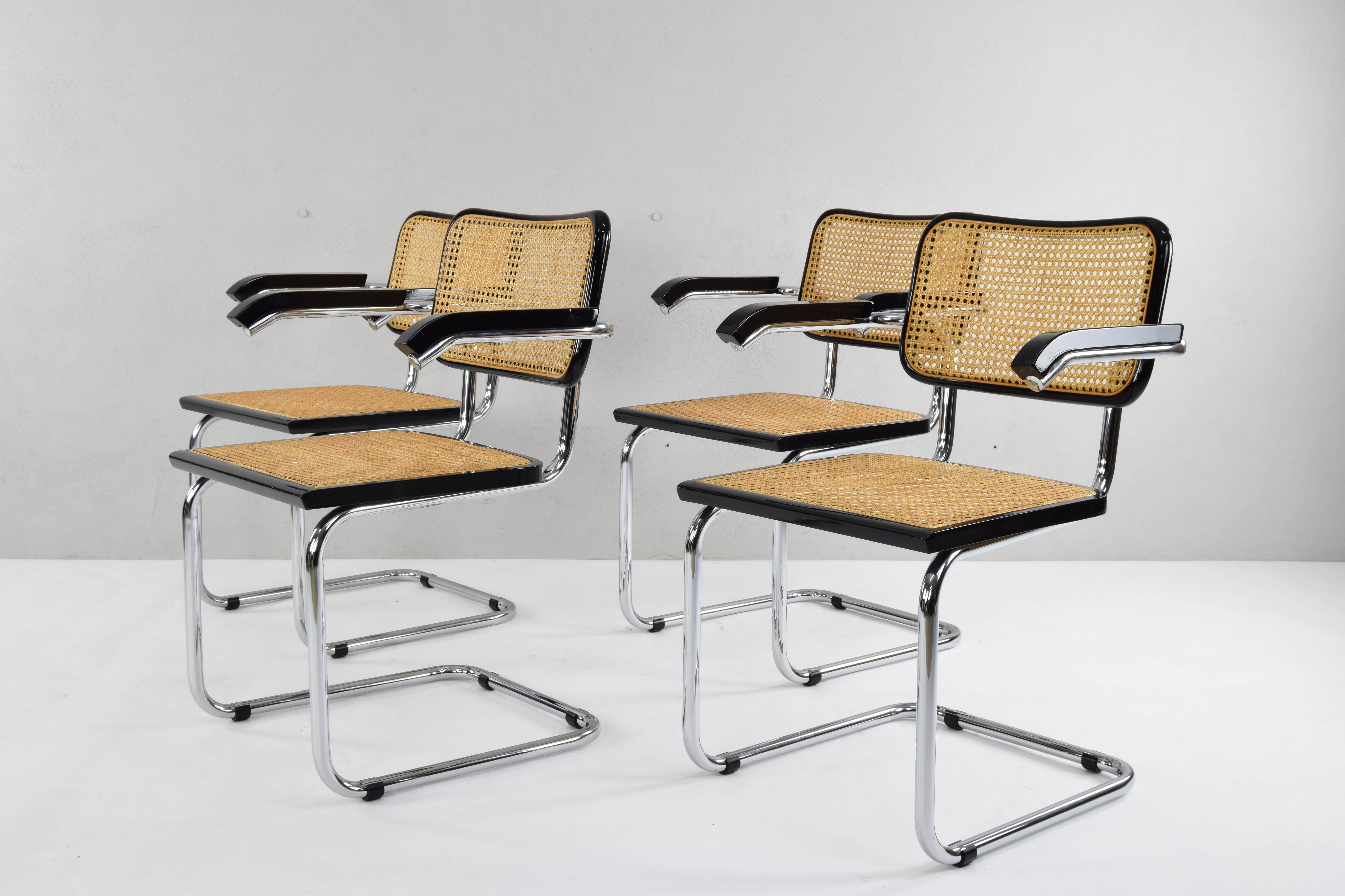 Set of four Cesca chairs model B64, with armrests. Tubular steel chromed structure in very good condition. Beechwood frames lacquered in black and Viennese natural grid. Grids of the four seats have been put new.
Measures:
Total height 83 cm
Seat