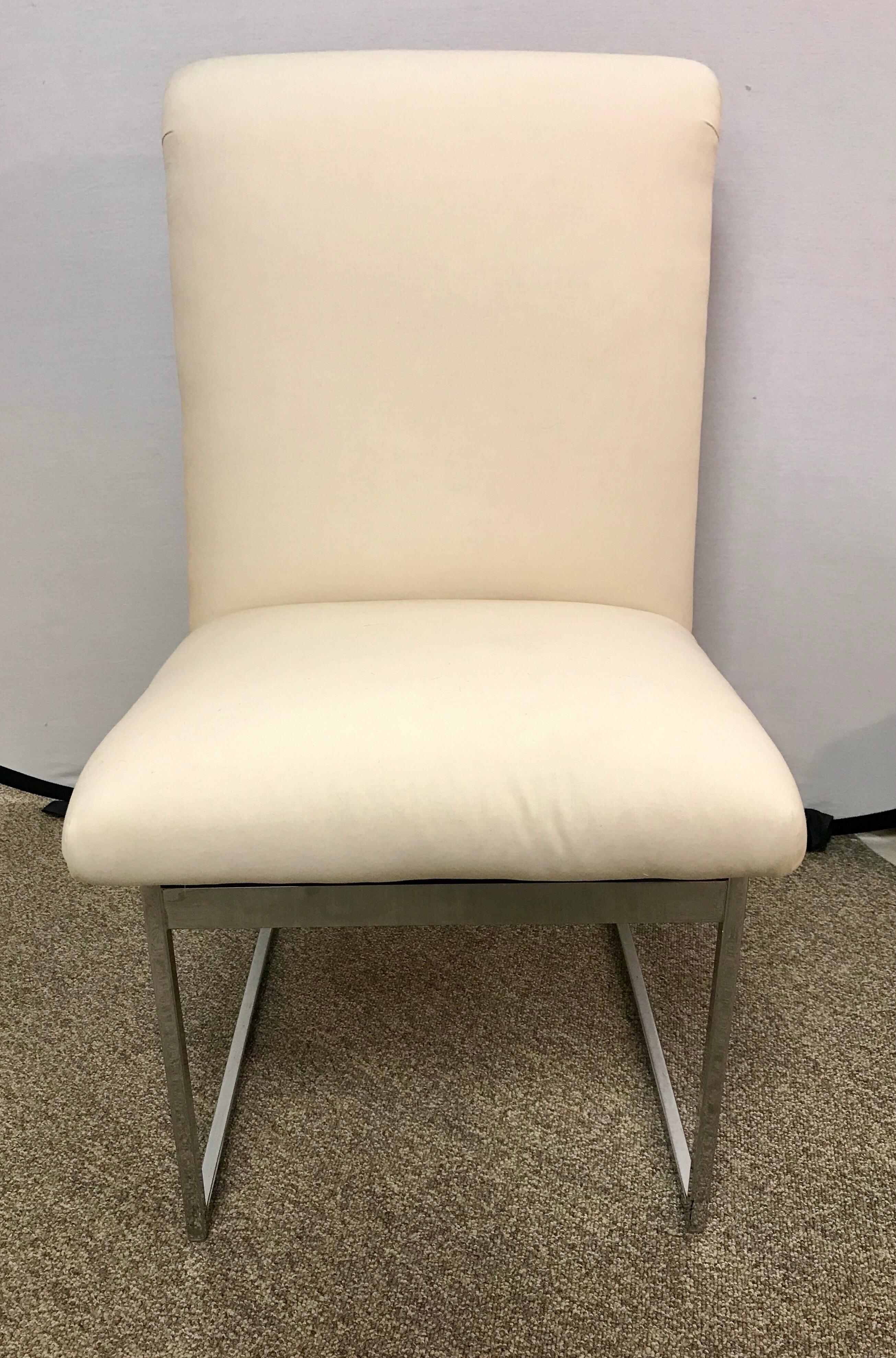 Elegant set of Milo Baughman style midcentury chairs with polished steel and off white newer fabric.
