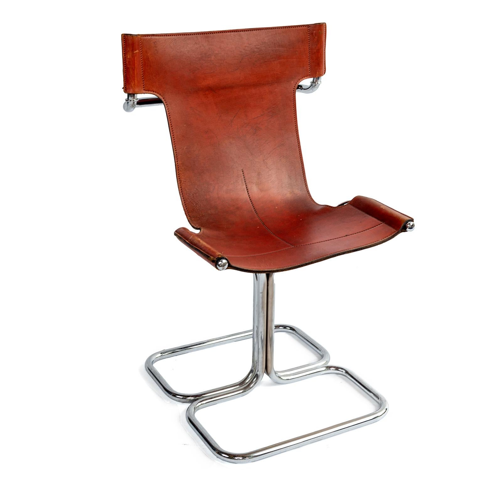 Set of four Mid-Century Modern T chairs in chrome and cognac leather.