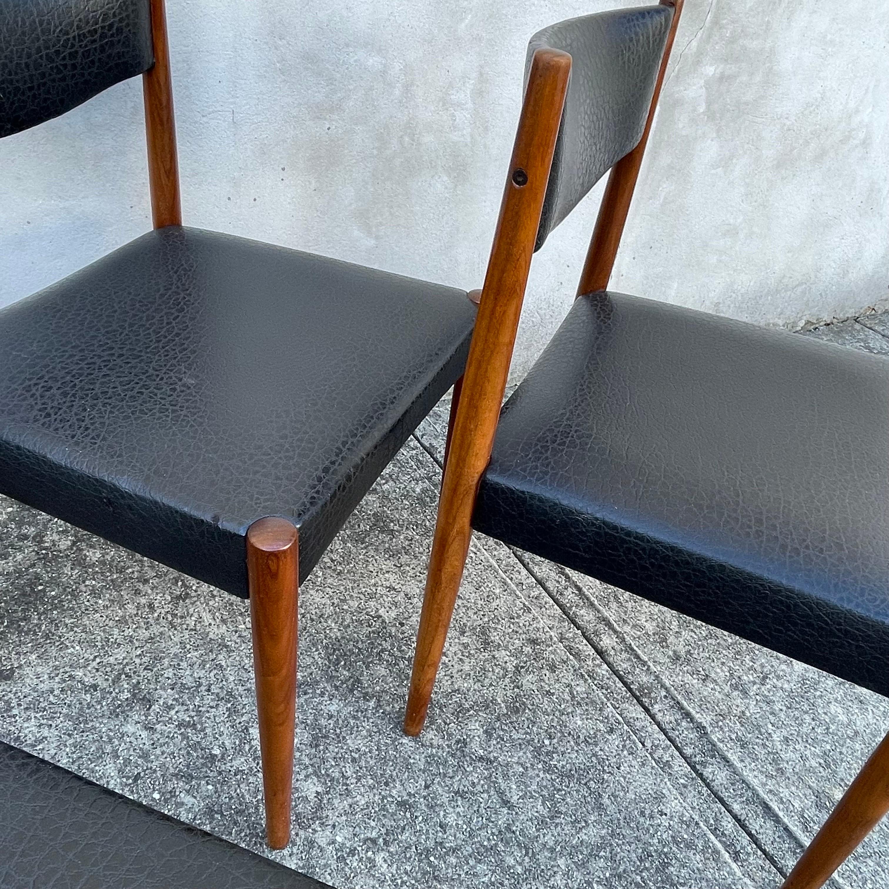 Faux Leather Set of Four Mid-Century Modern Teak Dining Chairs, Faux Black Leather Seats For Sale