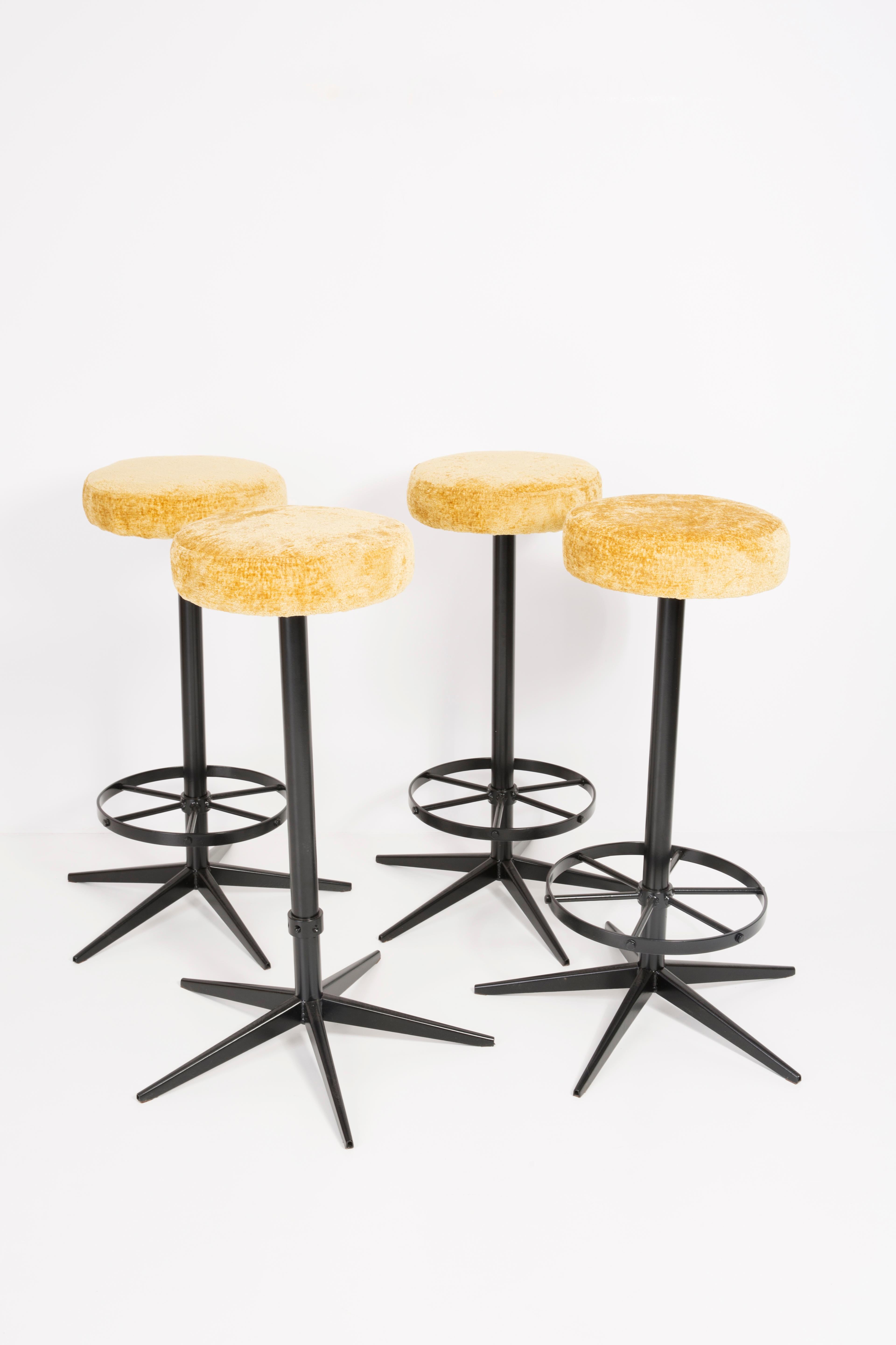 Stools from the turn of the 1960s. Produced in Germany. Beautiful, well crafted yellow italian upholstery. The stools consists of an upholstered part, a seat and steel black legs. They are not regulated. The height is constant.