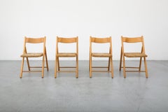Set of Four Mid-Century Oak Folding Chairs with Curved Backs and Rush Seats