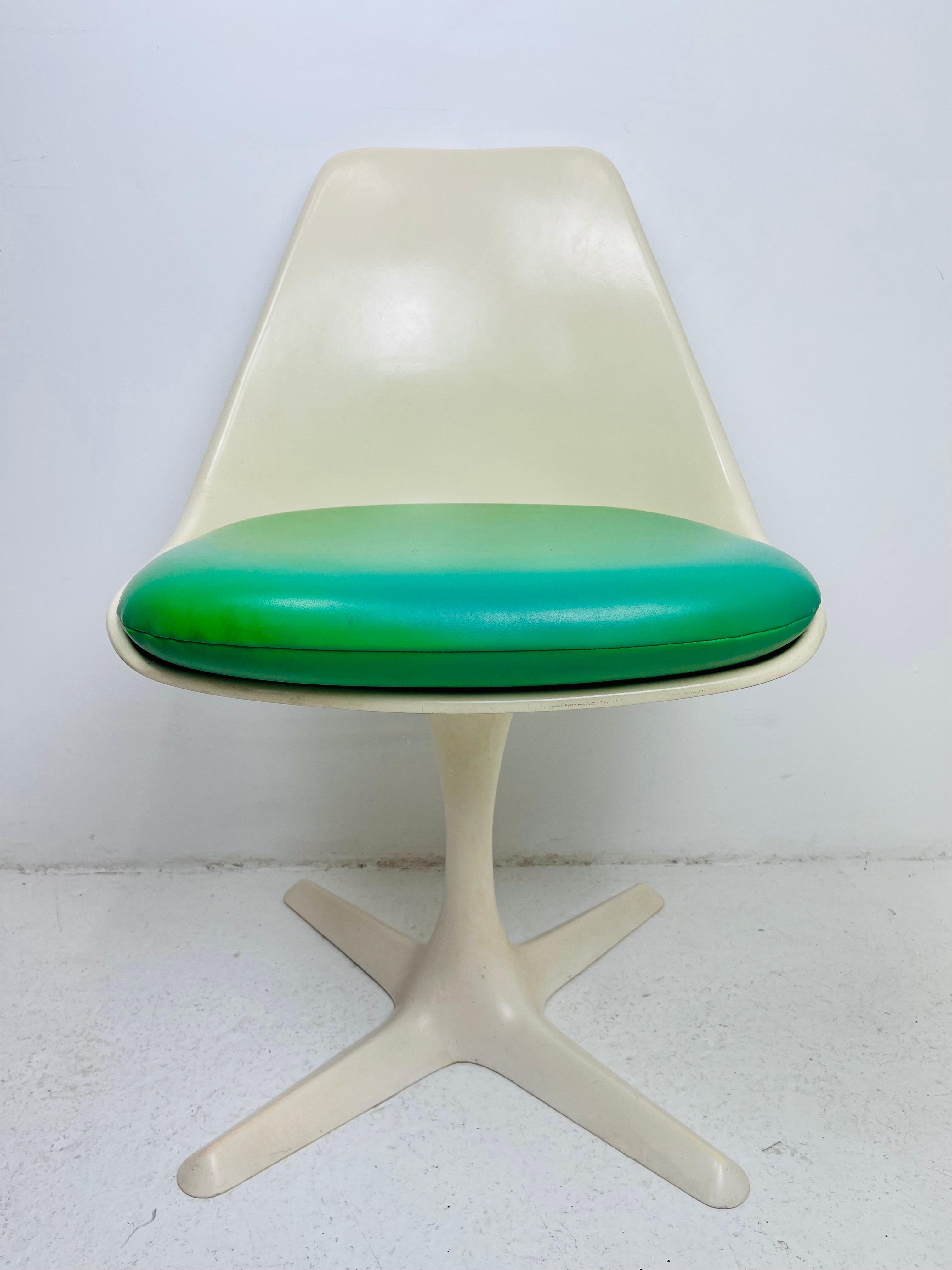 Set of 4 1970s propeller base tulip chairs by Burke. Original seats in good condition with some fading/discoloration; reupholstery is recommended. Labeled on underside.