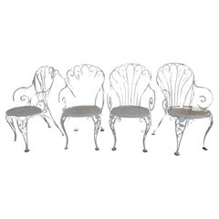 Set di quattro poltrone a rotelle Woodard della metà del secolo scorso con sedute in rete, circa 1955