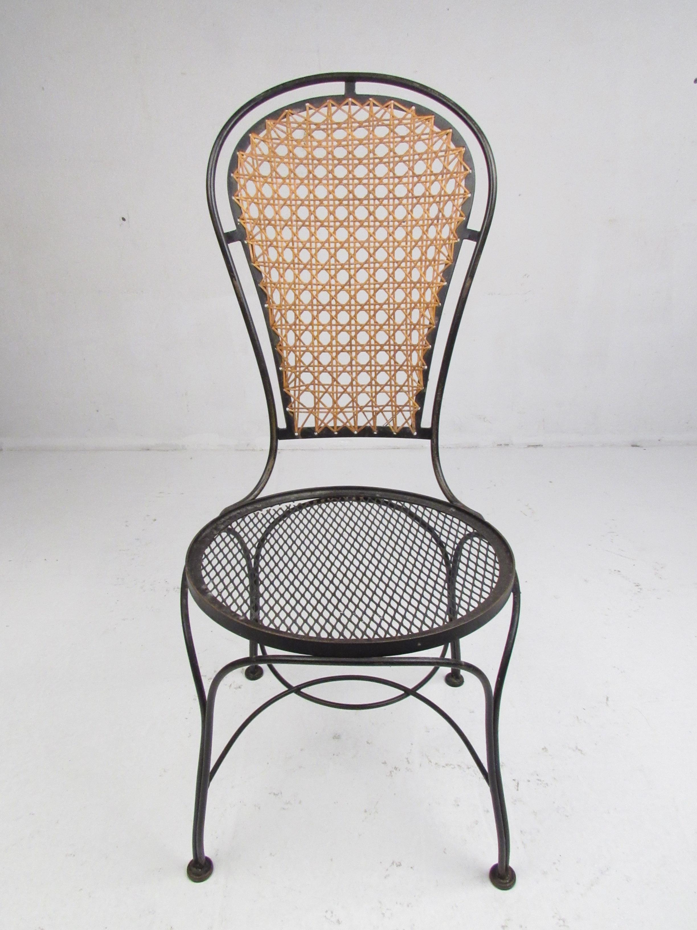 Mid-Century Modern Set of Four Midcentury Wrought Iron Dining Chairs with a Cane Backrest