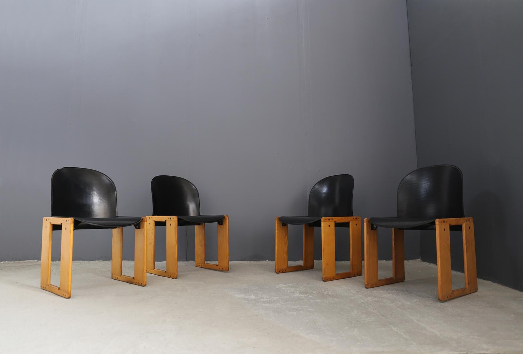 Set of four chairs model 121, leather and walnut, Italy, 1965. The set is in excellent condition.

The set is designed by designers Tobia and Afra Scarpa. These chairs have a cubic and architectural appearance. The base is composed of four