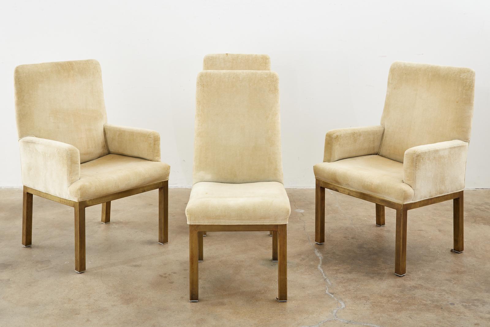 Distinctive set of four Mid-Century Modern dining chairs by Mastercraft. The set consists of two side chairs and two armchairs. The side chairs measure: 19 inches wide by 23 inches deep. The chairs feature a bronzed frame with a rich patina. Very